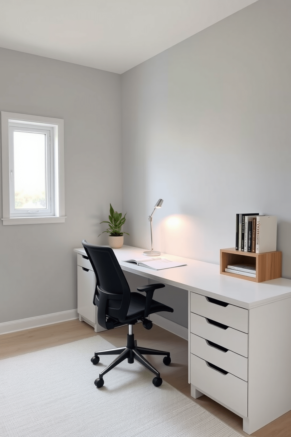 A minimalist study room featuring a sleek, white desk with clean lines and a comfortable ergonomic chair. The walls are painted a soft gray, and a single large window allows natural light to flood the space, highlighting a few carefully selected books on a simple wooden shelf. In the corner, a small potted plant adds a touch of greenery, while a minimalist lamp provides focused lighting for late-night study sessions. The floor is adorned with a light-colored area rug that complements the overall serene atmosphere of the room.