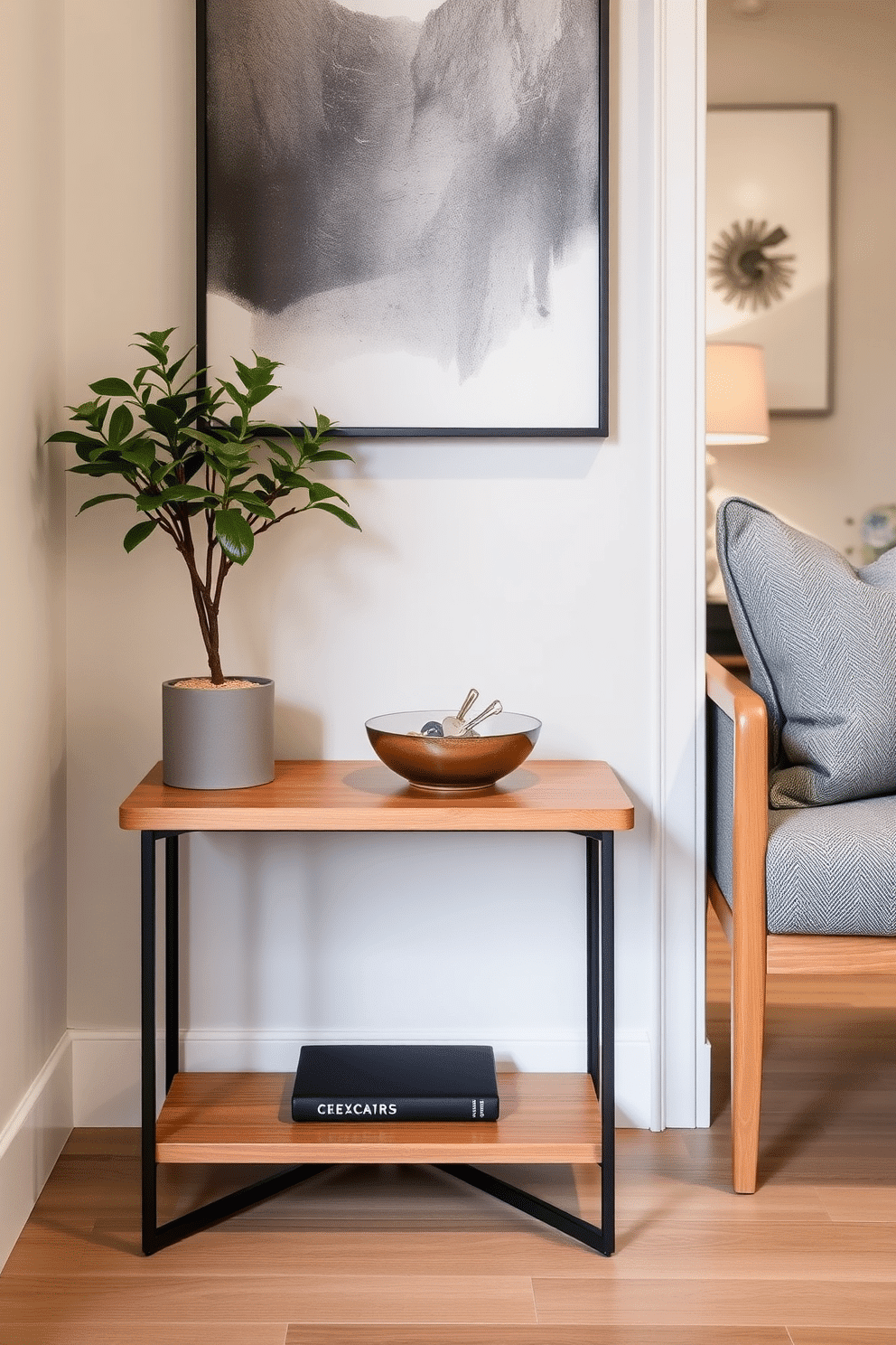 A stylish small side table designed for keys and essentials sits in a chic condo entryway. The table features a sleek, minimalist design with a warm wood finish, complemented by a decorative bowl for holding keys and a small potted plant for a touch of greenery.