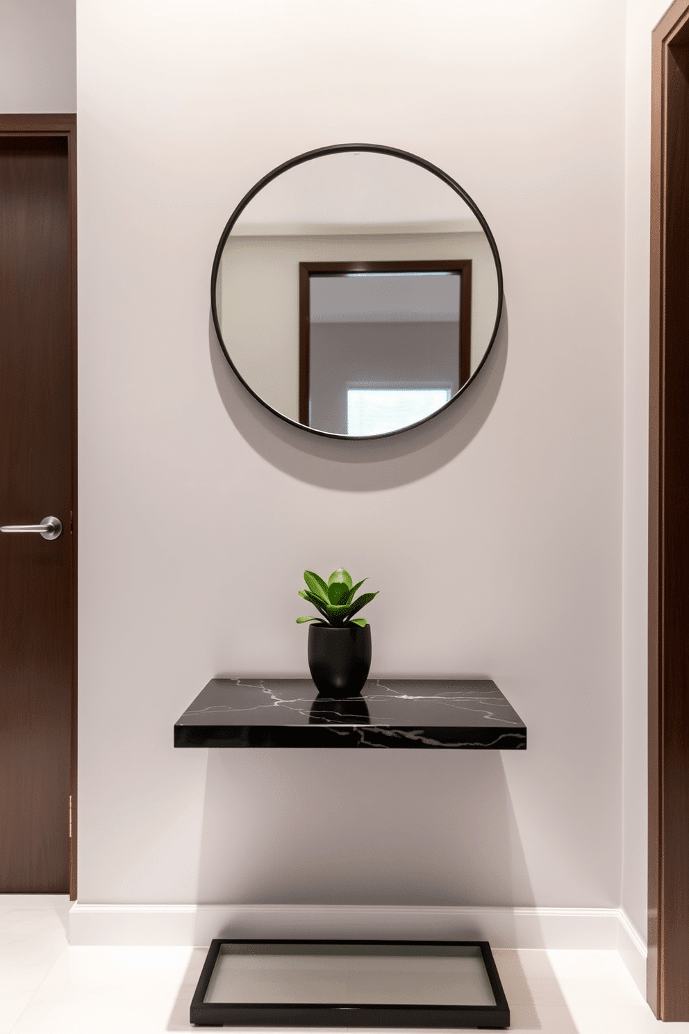 A stylish condo entryway features a sleek small console table with a glossy finish, positioned against a soft gray wall. Above the table, a round mirror with a thin black frame reflects natural light, while a small potted plant adds a touch of greenery to the space.