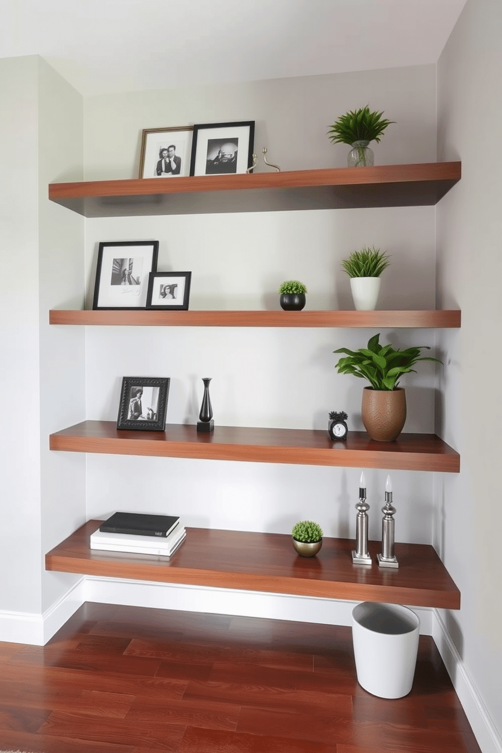 A stylish condo entryway features sleek floating shelves adorned with decorative accents such as framed photos, small potted plants, and a few elegant sculptures. The walls are painted in a soft gray, while the floor is a polished hardwood that complements the modern aesthetic.