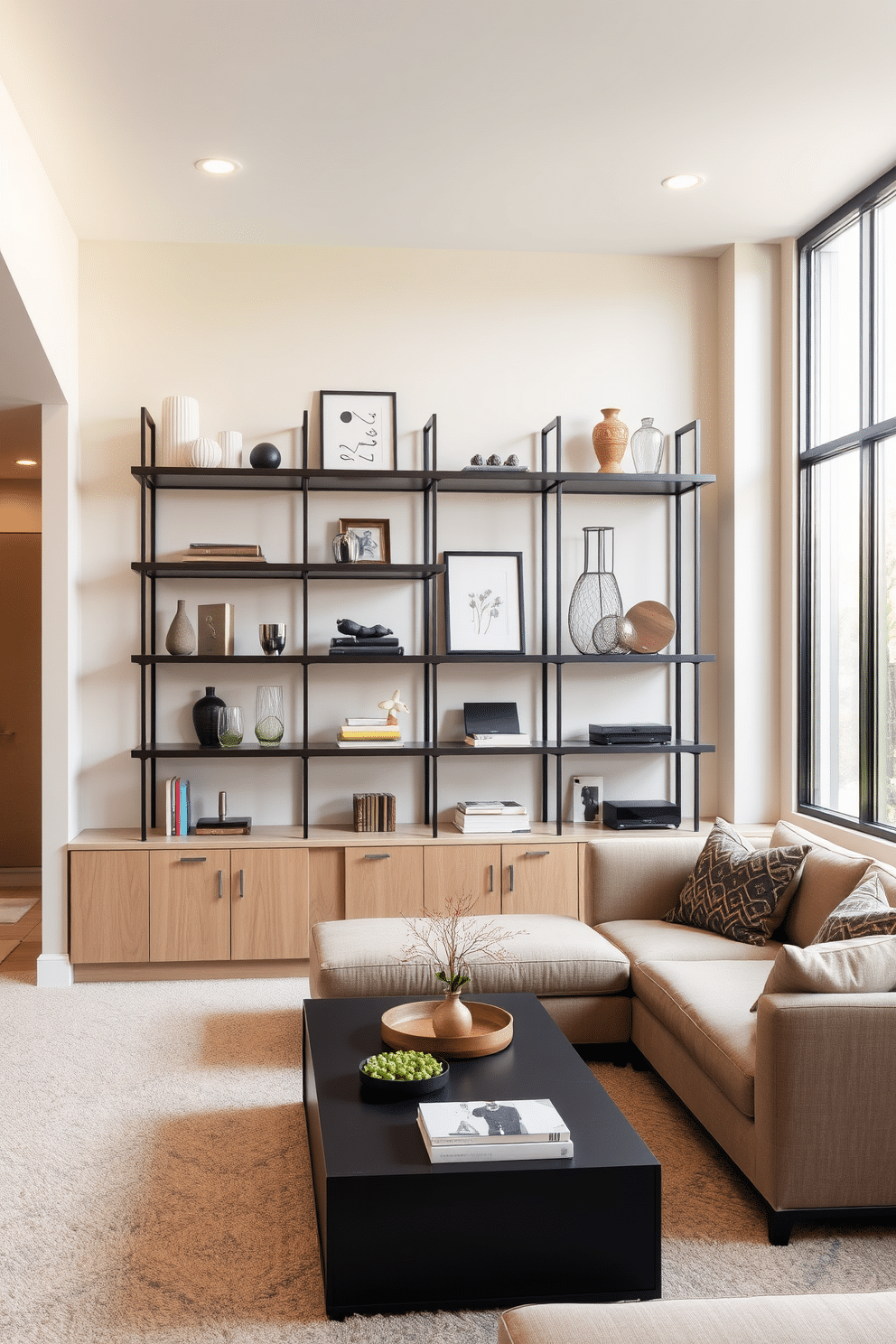 A contemporary basement design features open shelving that elegantly displays a curated selection of decor items, blending functionality with aesthetic appeal. The shelves are crafted from sleek metal and wood, providing a modern contrast against the soft, neutral-toned walls. The basement area is designed with cozy seating arrangements, including a plush sectional sofa and a stylish coffee table, creating an inviting atmosphere for relaxation and entertainment. Large windows allow natural light to flood the space, enhancing the overall ambiance and making it feel more expansive.