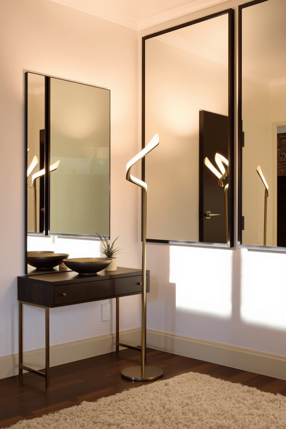 A sculptural floor lamp stands elegantly in the corner of a contemporary foyer, casting a warm glow across the space. The lamp features a unique, abstract design with a polished brass finish that complements the modern aesthetic of the area. The foyer is adorned with a sleek console table made of dark wood, topped with a minimalist decorative bowl and a small potted plant. Large, frameless mirrors line the walls, reflecting light and creating a sense of openness, while a plush area rug anchors the space beneath.