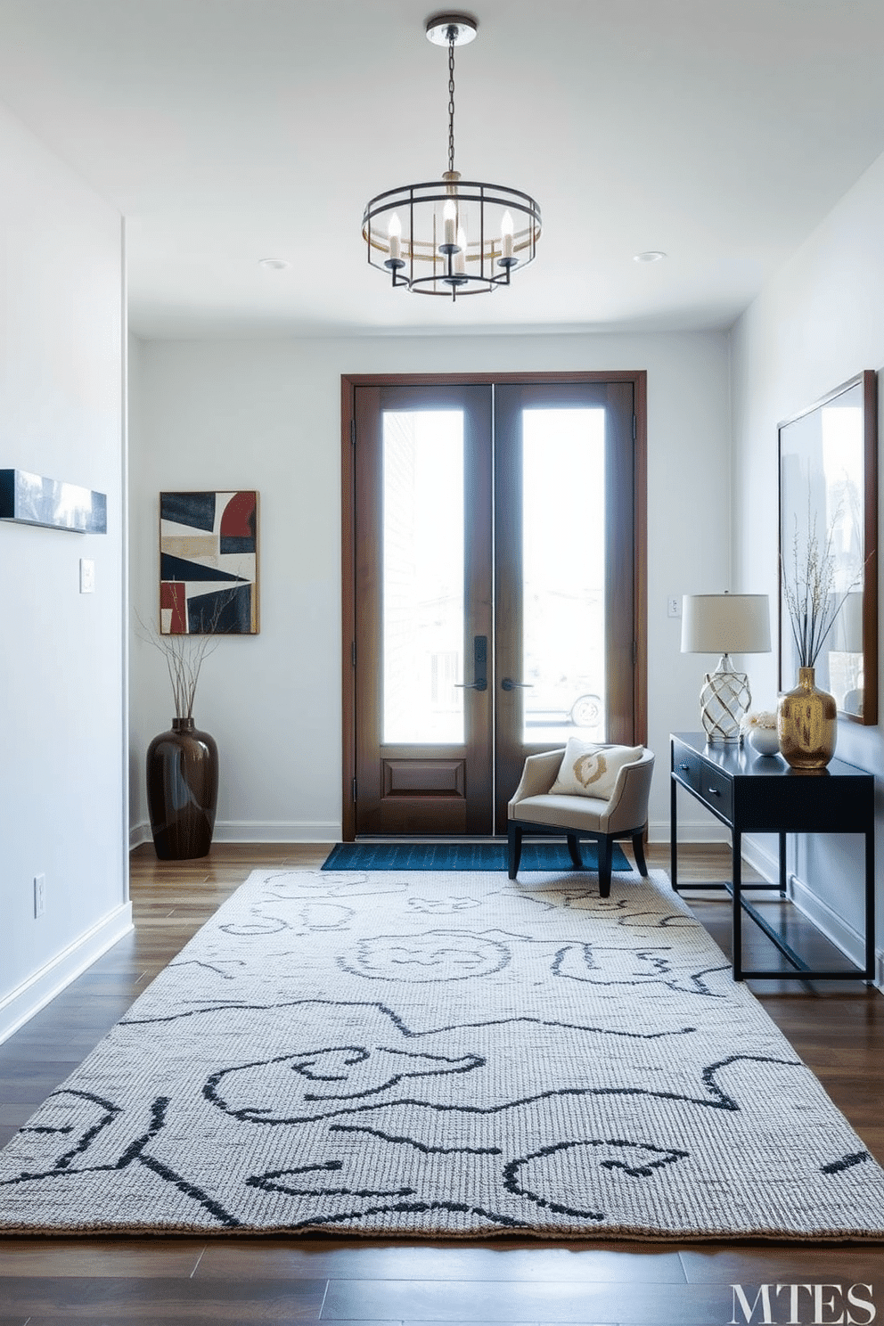 A contemporary foyer featuring a textured area rug that adds warmth and comfort to the space. The walls are adorned with sleek, modern art pieces, and natural light floods in through a large window, illuminating the inviting atmosphere.