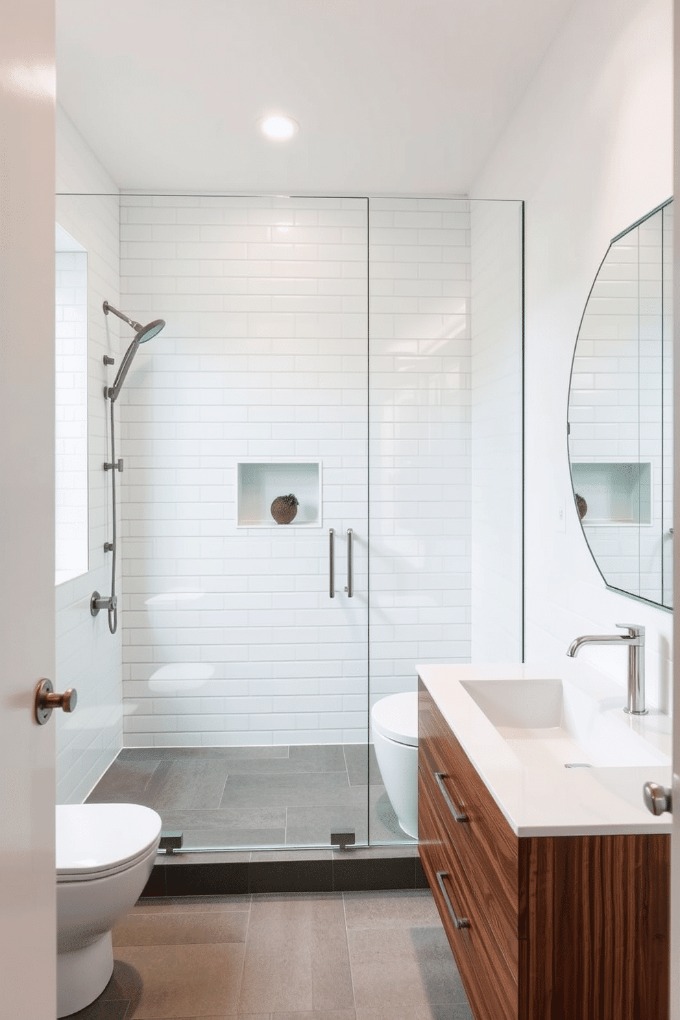 A contemporary powder room featuring a sleek glass shower enclosure that enhances the sense of openness. The walls are adorned with elegant white tiles, and a floating vanity in a rich walnut finish adds warmth to the space.