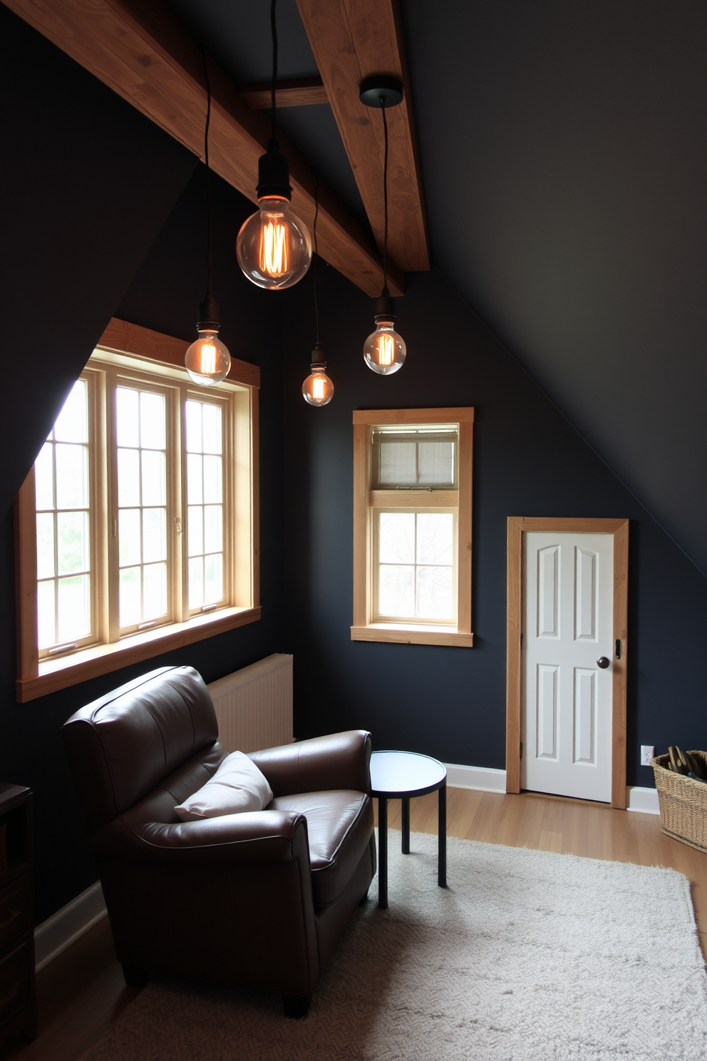 A cozy attic room featuring industrial-style fixtures with Edison bulbs hanging from exposed beams. The walls are painted in a deep charcoal gray, complemented by warm wooden accents and a plush area rug in neutral tones. In one corner, a vintage leather armchair sits beside a small side table, creating a perfect reading nook. Large windows allow natural light to flood the space, highlighting the unique architectural features of the sloped ceiling.