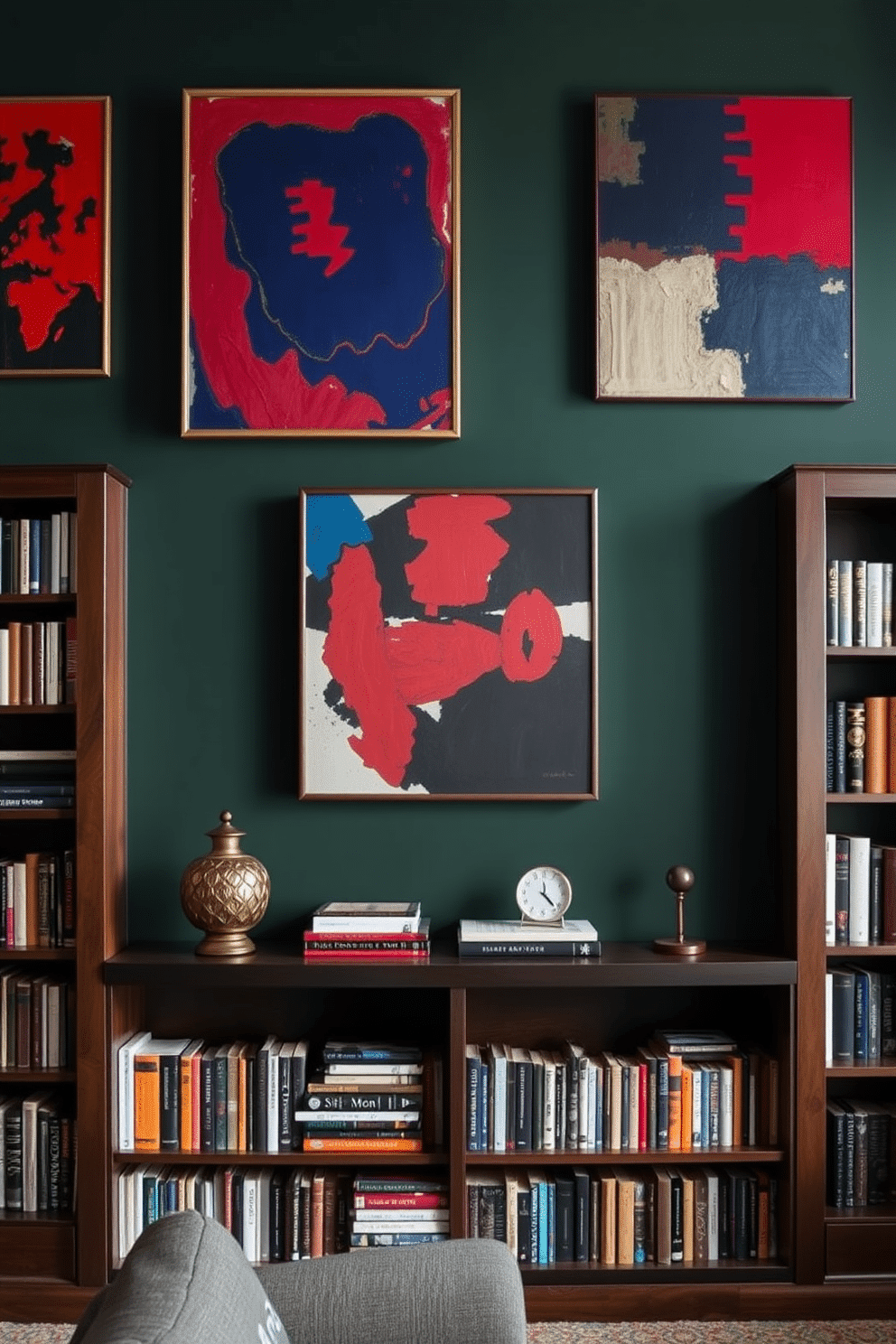 Artistic wall decor in contrasting colors. The walls are adorned with a mix of abstract paintings featuring bold reds and deep blues, creating a striking visual impact. Dark Green Home Library Design Ideas. The library features rich dark green walls complemented by dark wood bookshelves filled with an array of books, creating a cozy and inviting atmosphere.