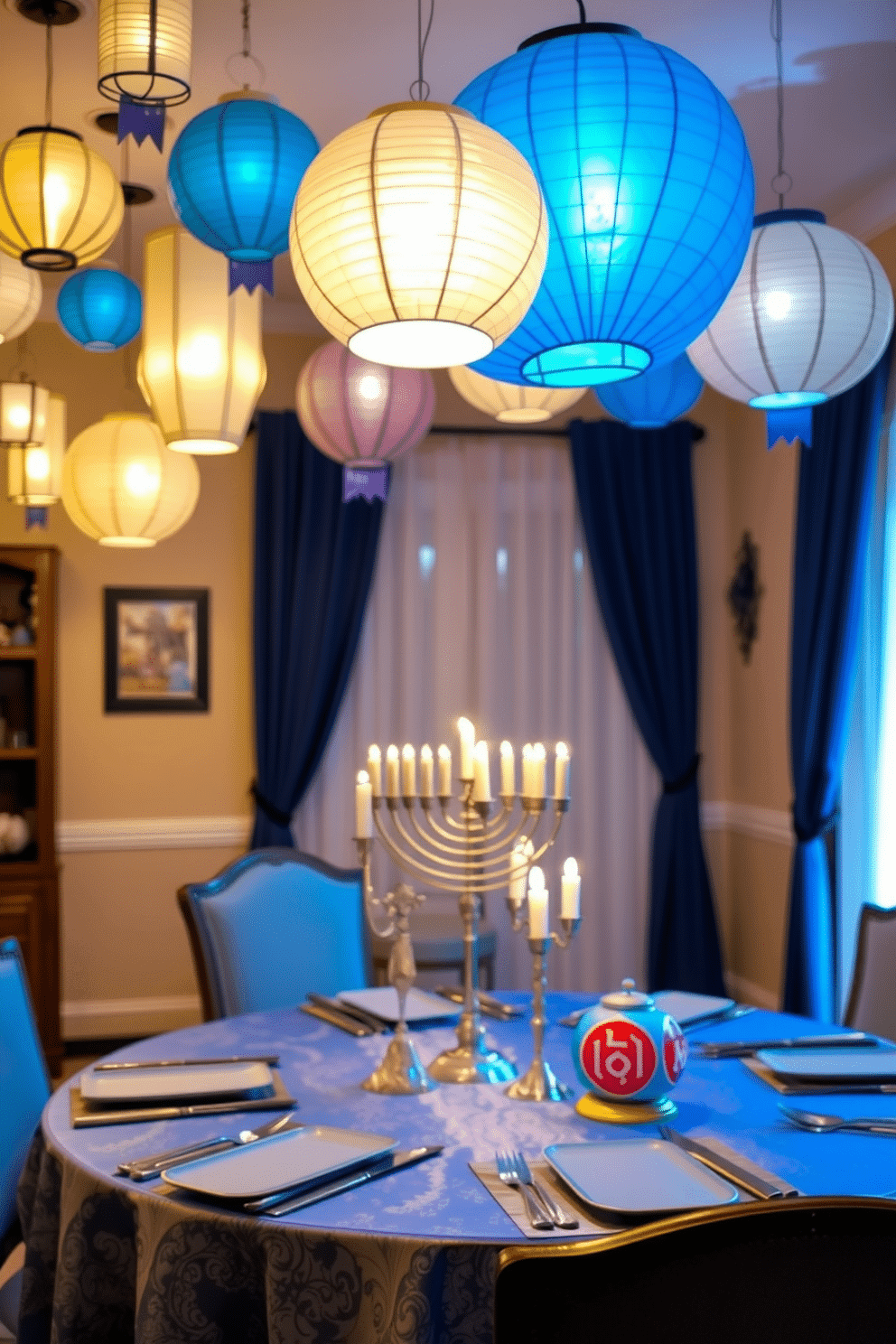 A cozy dining room adorned with hanging paper lanterns that cast a warm, inviting glow. The table is elegantly set with a festive blue and silver tablecloth, featuring decorative menorahs and vibrant dreidels as centerpieces.