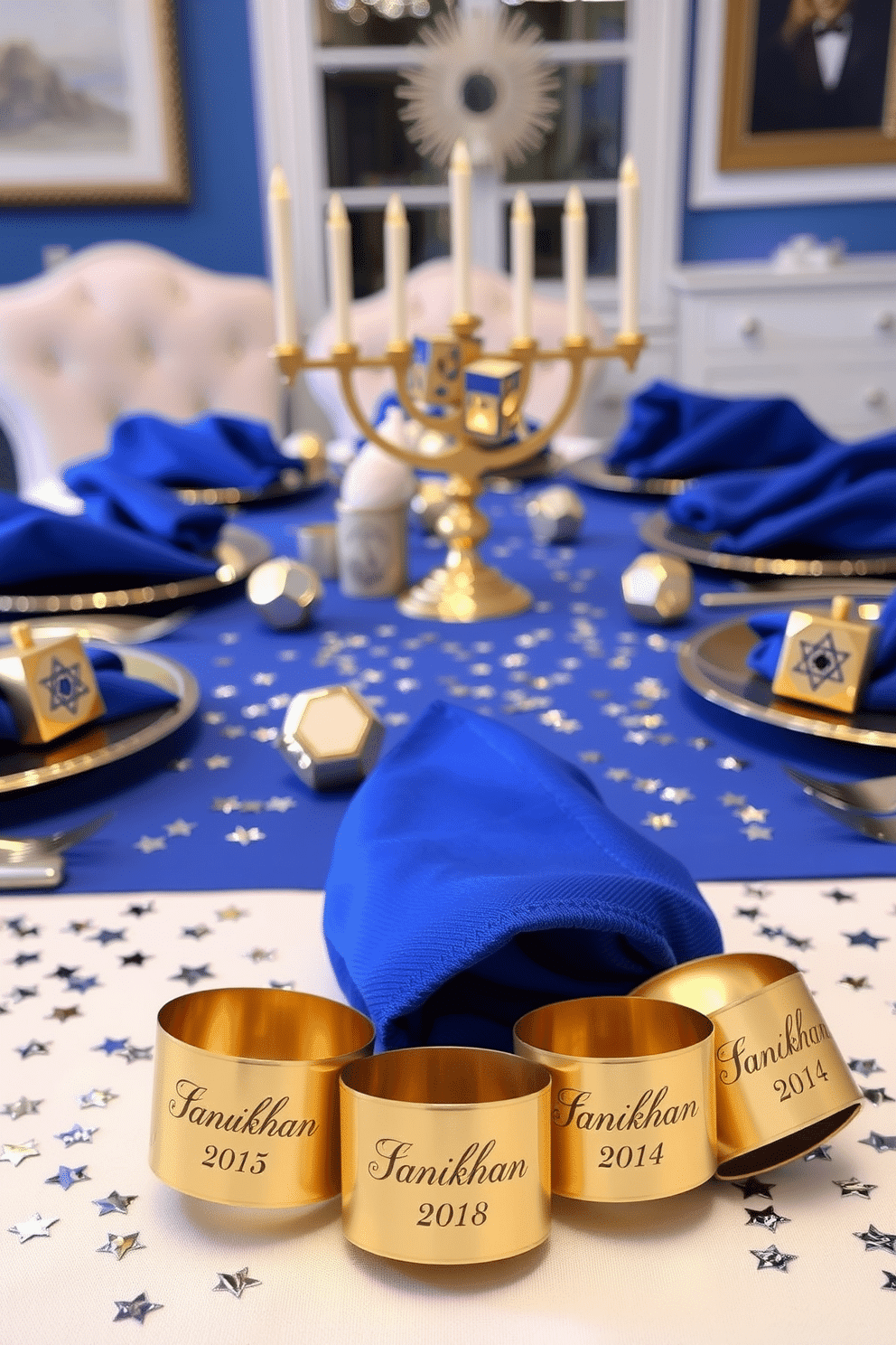 A set of personalized napkin rings designed for an elegant dining experience. Each napkin ring features intricate engravings of the guests' names, complemented by a rich gold finish that adds a touch of luxury. For a festive dining room during Hanukkah, the table is adorned with a vibrant blue and silver color scheme. Centered is a stunning menorah, surrounded by decorative dreidels and shimmering star-shaped confetti that captures the spirit of the holiday.