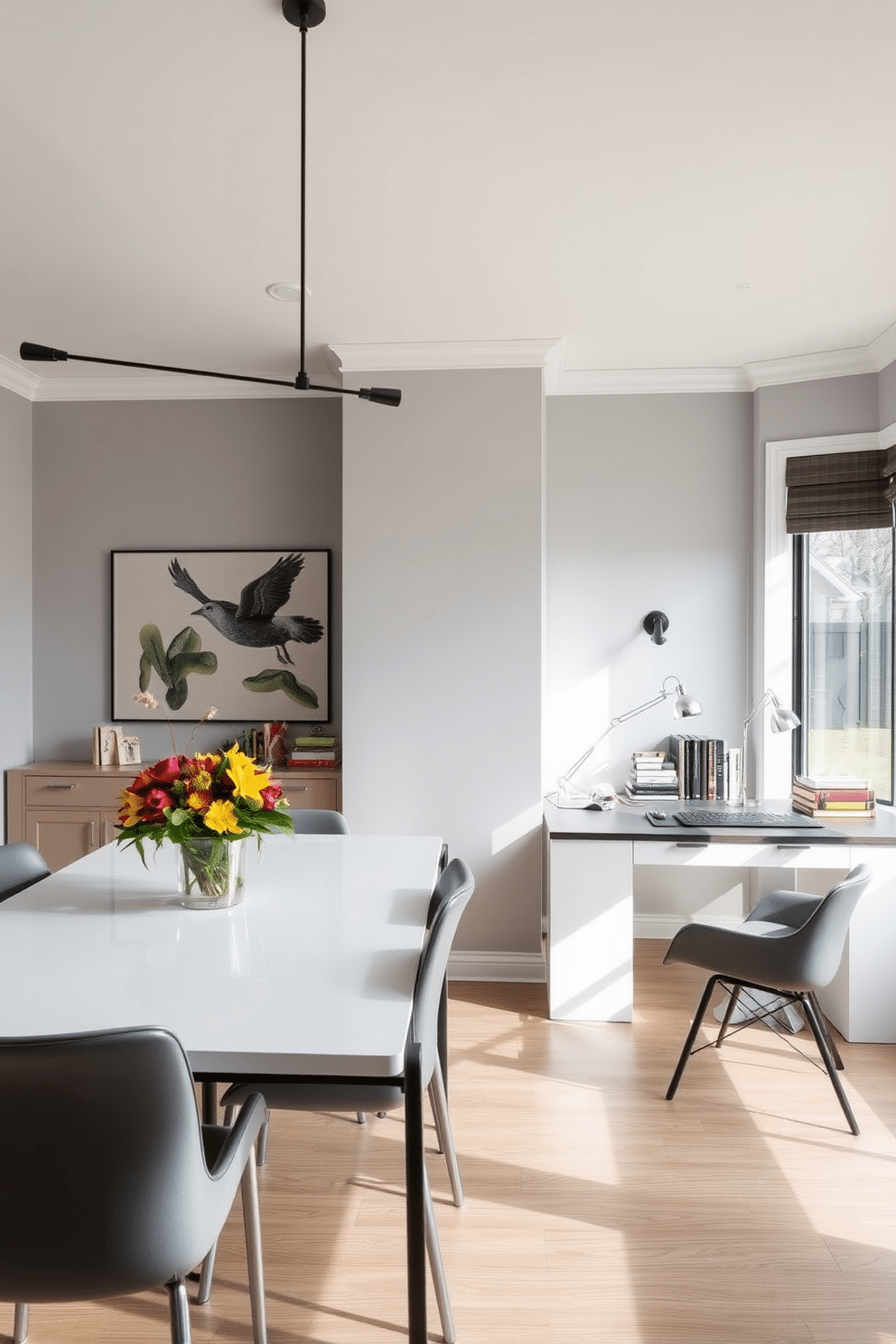 A modern dining room office combo with a sleek dining table positioned under elegant task lighting. The table is surrounded by contemporary chairs, while a stylish desk is integrated into the space, creating a seamless blend of dining and workspace. The walls are painted in a soft gray tone, enhancing the room's airy feel, and large windows allow natural light to flood in. Decorative elements like a vibrant centerpiece on the dining table and organized office supplies on the desk add character and functionality to the design.