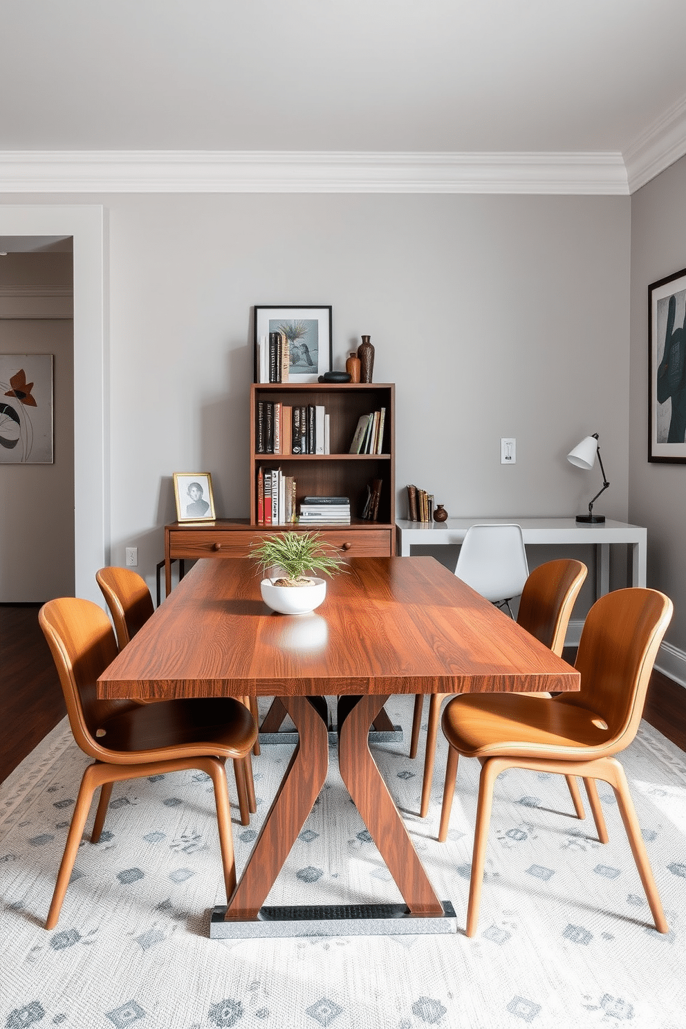 A stylish dining room office combo featuring a sleek wooden table that comfortably seats six. Behind the table, a small bookshelf filled with reference materials and decorative items adds a touch of sophistication to the space. The walls are painted in a soft gray, complemented by modern artwork that enhances the ambiance. A contemporary desk with a minimalist design sits adjacent to the dining table, creating a seamless transition between work and dining areas.