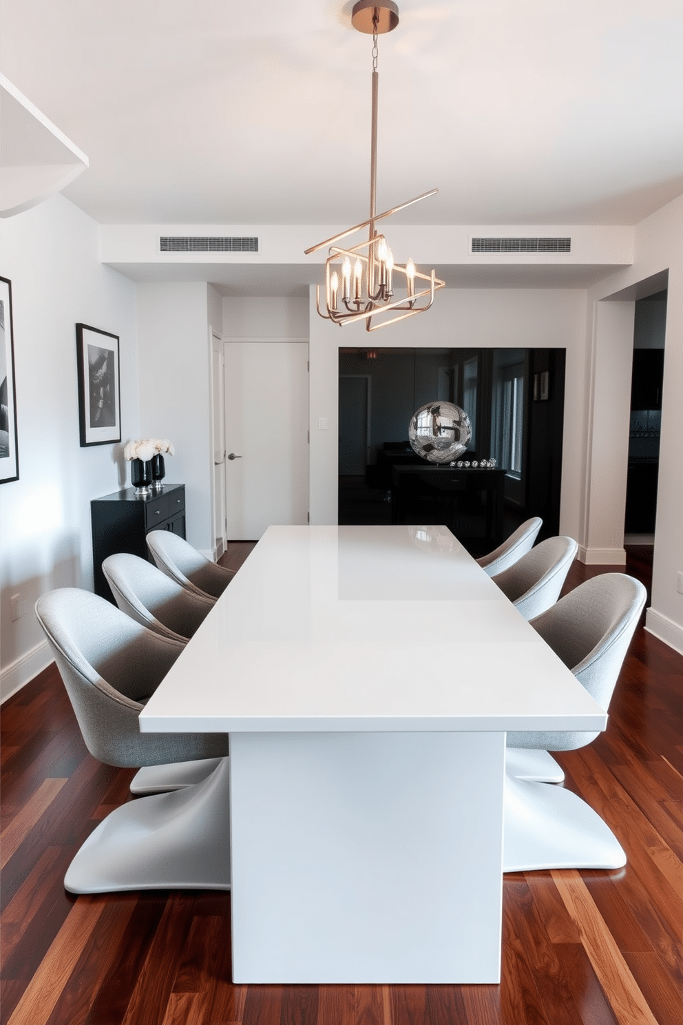 A sleek white lacquer dining table takes center stage in a modern dining room, reflecting light and enhancing the sense of space. Surrounding the table, minimalist chairs with soft gray upholstery complement the table's elegance, creating a harmonious balance. Above the table, a striking chandelier with geometric lines adds a touch of sophistication, casting a warm glow over the setting. The walls are adorned with subtle artwork, while the floor features a rich hardwood that contrasts beautifully with the table's sleek surface.