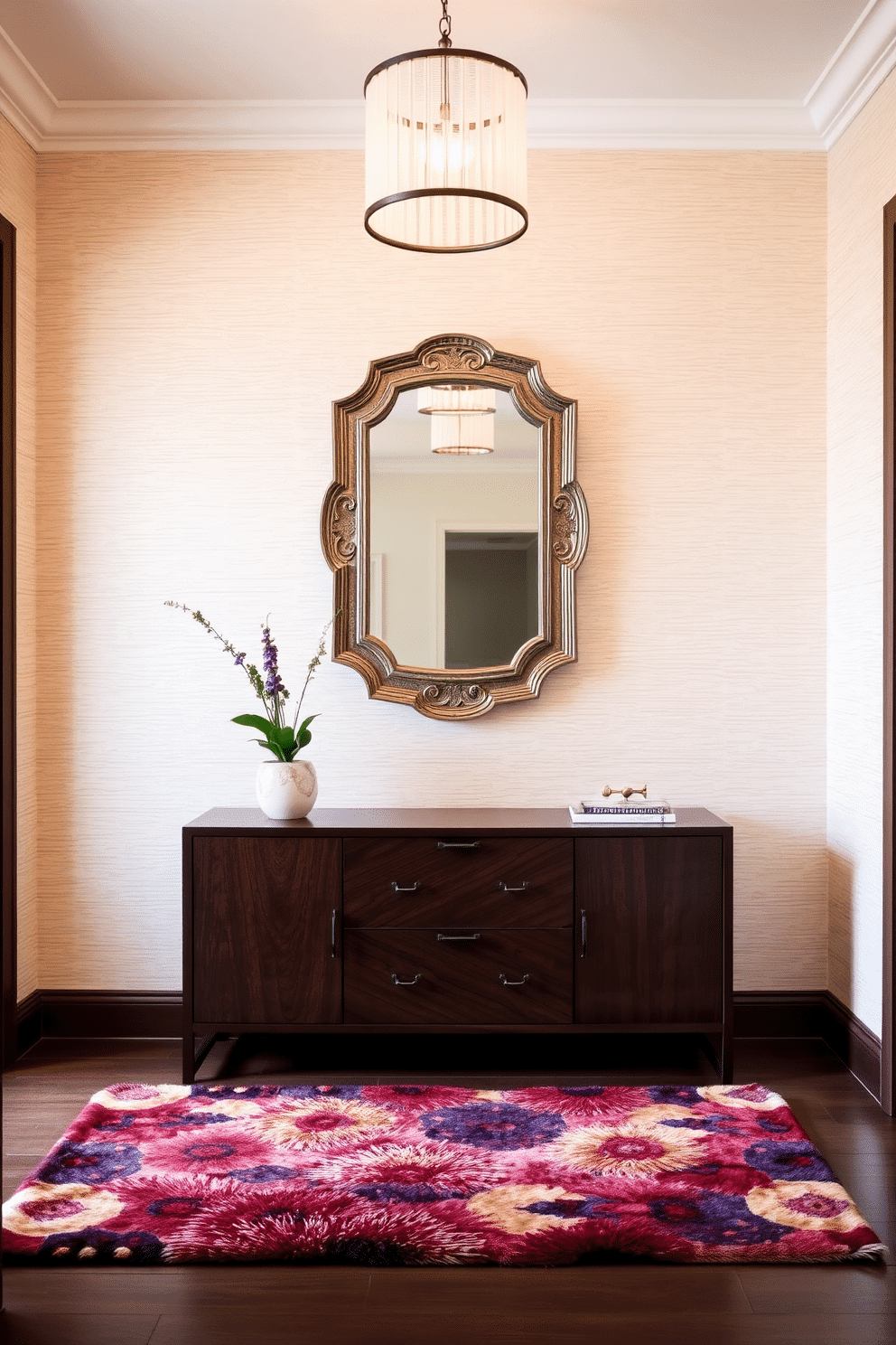 A stunning entryway featuring textured wallpaper that adds depth and character to the space. The walls are adorned with a subtle geometric pattern in soft neutral tones, complemented by a sleek console table in a dark wood finish. A chic mirror with an ornate frame hangs above the console, reflecting the warm light from a stylish pendant fixture overhead. A plush area rug in rich colors anchors the space, while a small potted plant adds a touch of greenery to the inviting atmosphere.