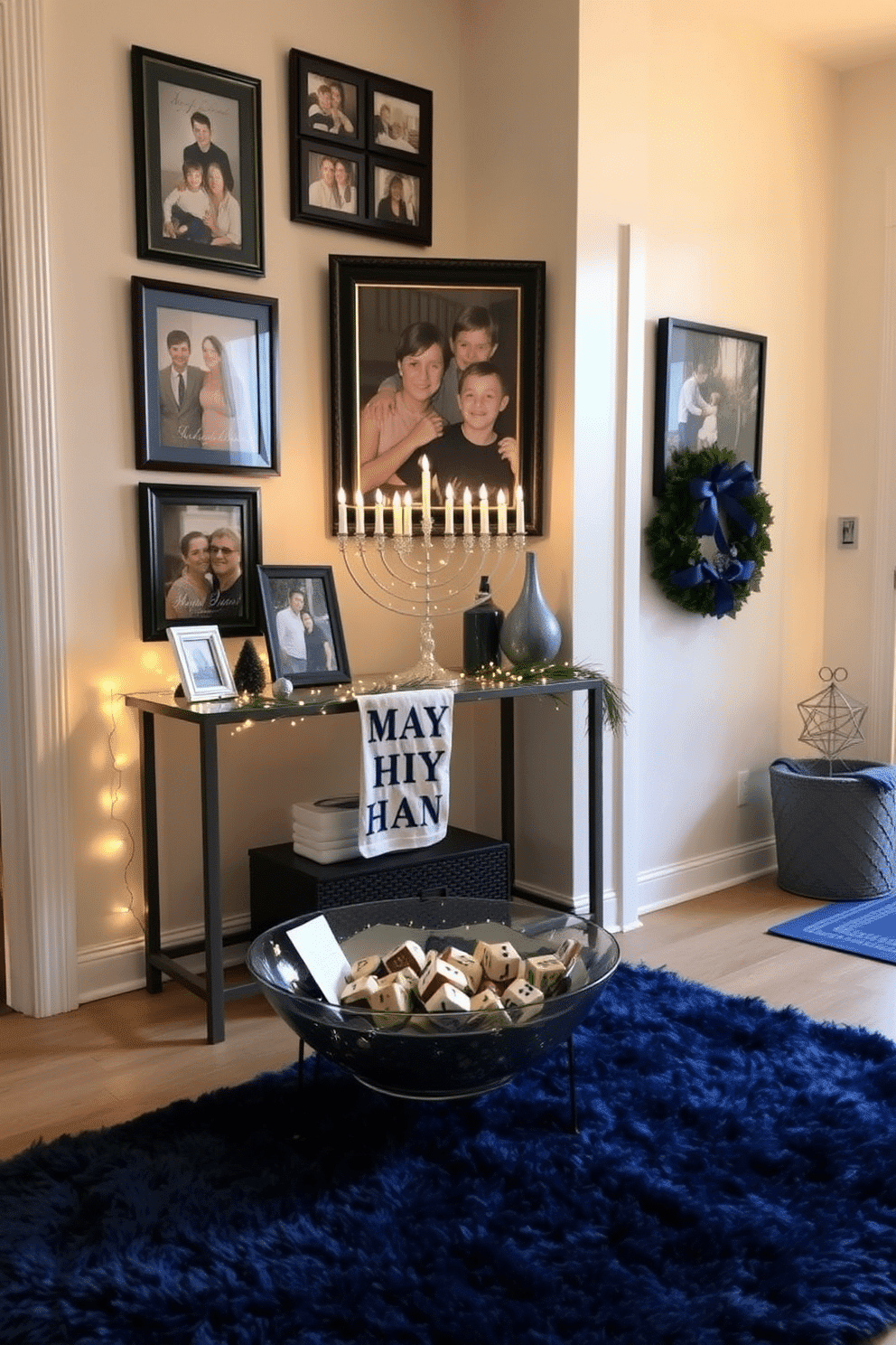 A warm and inviting entryway adorned with framed family photos celebrating Hanukkah. The walls are decorated with blue and silver accents, while a festive menorah sits on a console table, surrounded by twinkling fairy lights. The floor is covered with a plush area rug in deep blue, providing a cozy touch. A decorative bowl filled with dreidels and gelt adds a playful element to the space, welcoming guests with holiday cheer.