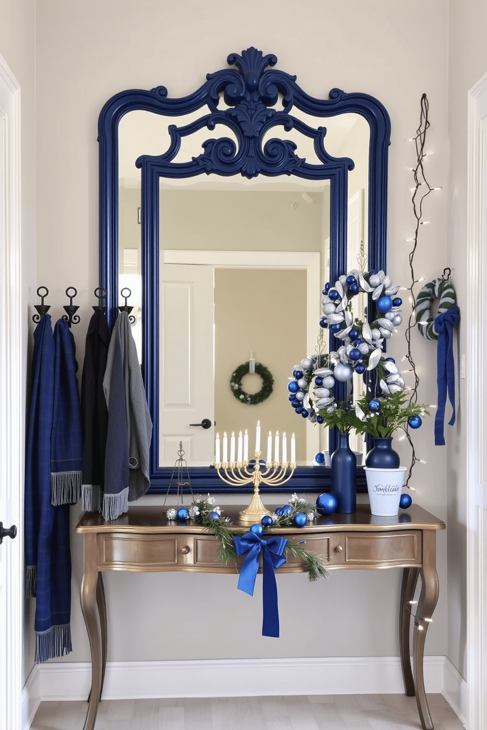 A stylish entryway features a large, ornate mirror with a deep blue frame, reflecting light and enhancing the space. Surrounding the mirror, a collection of decorative hooks in matching blue accents hold winter scarves and hats, adding both functionality and flair. For Hanukkah, the entryway is adorned with festive decorations, including a beautifully arranged menorah on a console table. Blue and silver accents are incorporated throughout, with wreaths made of blue ornaments and twinkling fairy lights draped elegantly around the doorframe.