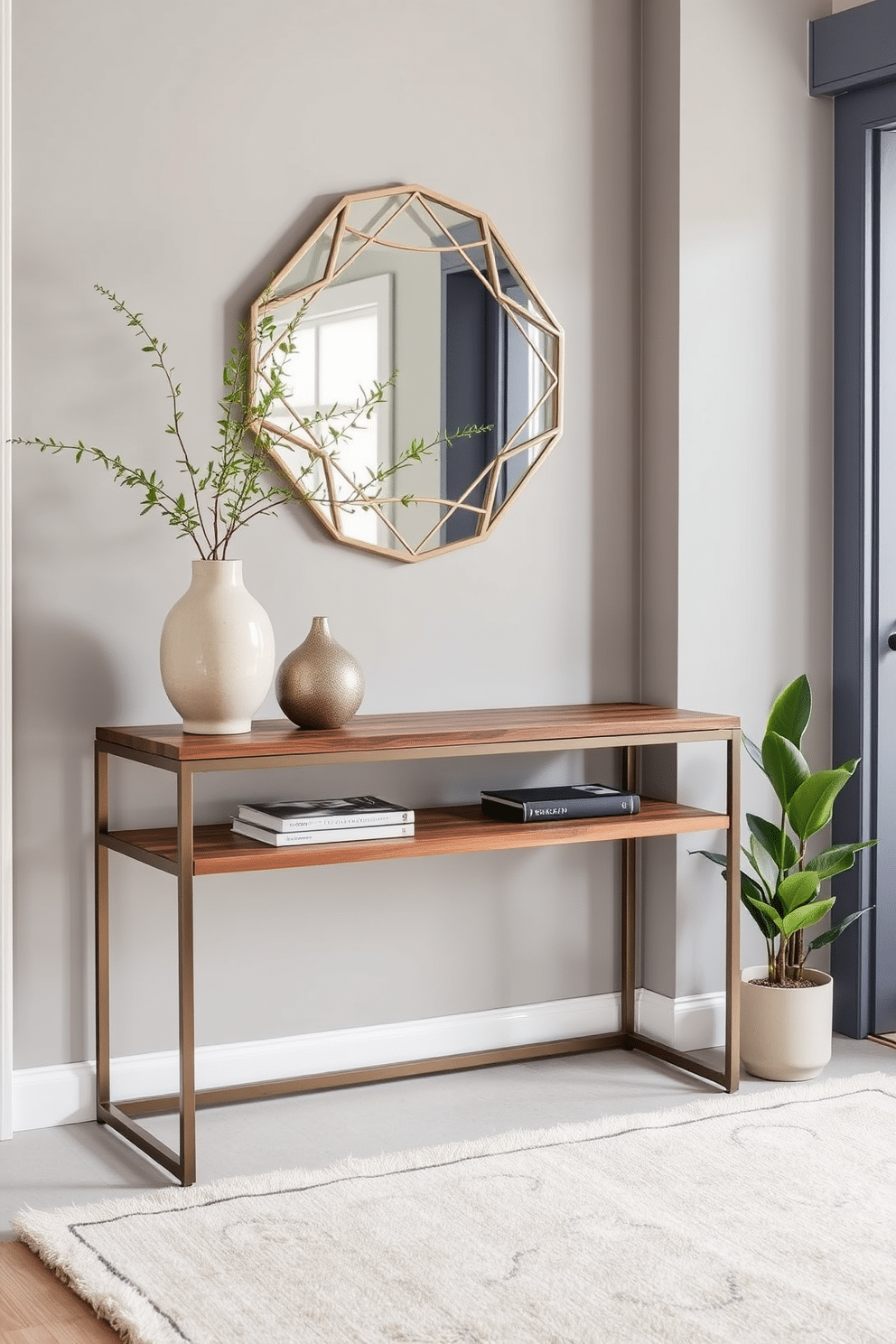 A stylish entryway featuring a sleek metal console table with a rich walnut wood top, complemented by decorative elements like a sculptural vase and a geometric mirror above. The walls are painted in a soft gray, and a plush area rug in muted tones adds warmth to the space, while potted greenery brings a touch of nature indoors.