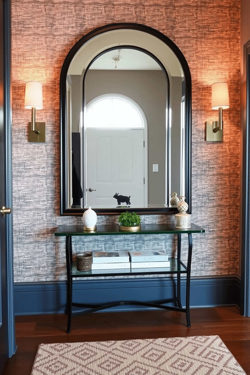 A striking statement mirror serves as the focal point of the entryway, reflecting light and creating an illusion of space. Flanked by stylish sconces, the mirror is set against a textured wallpaper that adds depth and interest to the wall. To enhance the entryway, consider incorporating a console table beneath the mirror, adorned with decorative objects and a small plant. The floor features a chic runner that complements the color palette, providing a warm welcome as guests enter.