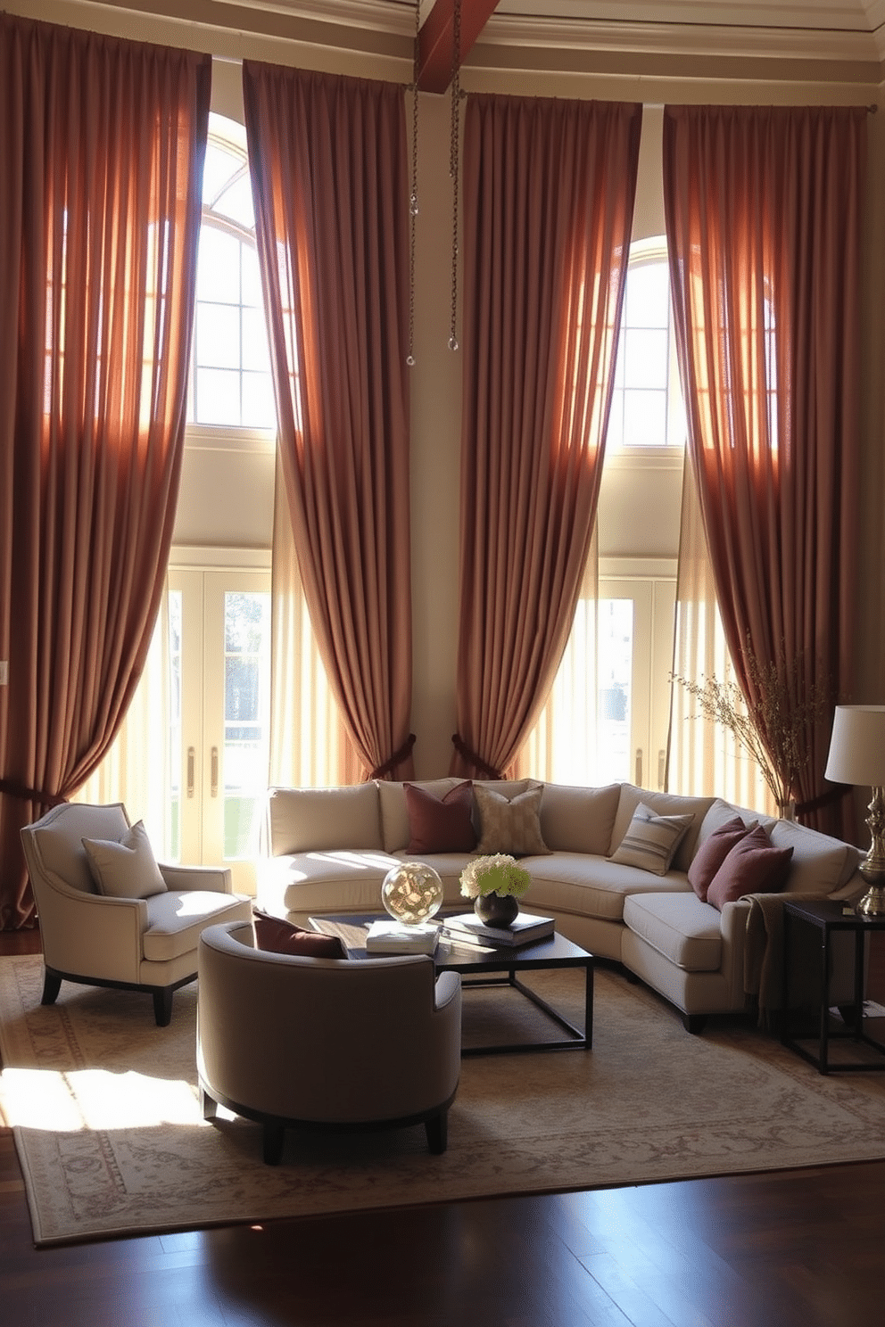 Elegant drapery in soft, flowing fabrics frames large, sunlit windows, creating a warm and inviting atmosphere. The drapes are in a rich, muted color that complements the room's overall palette, adding a touch of sophistication. The family room features a cozy seating area with a plush sectional sofa and a pair of accent chairs, arranged around a stylish coffee table. A large area rug anchors the space, while decorative cushions and throws add texture and comfort.