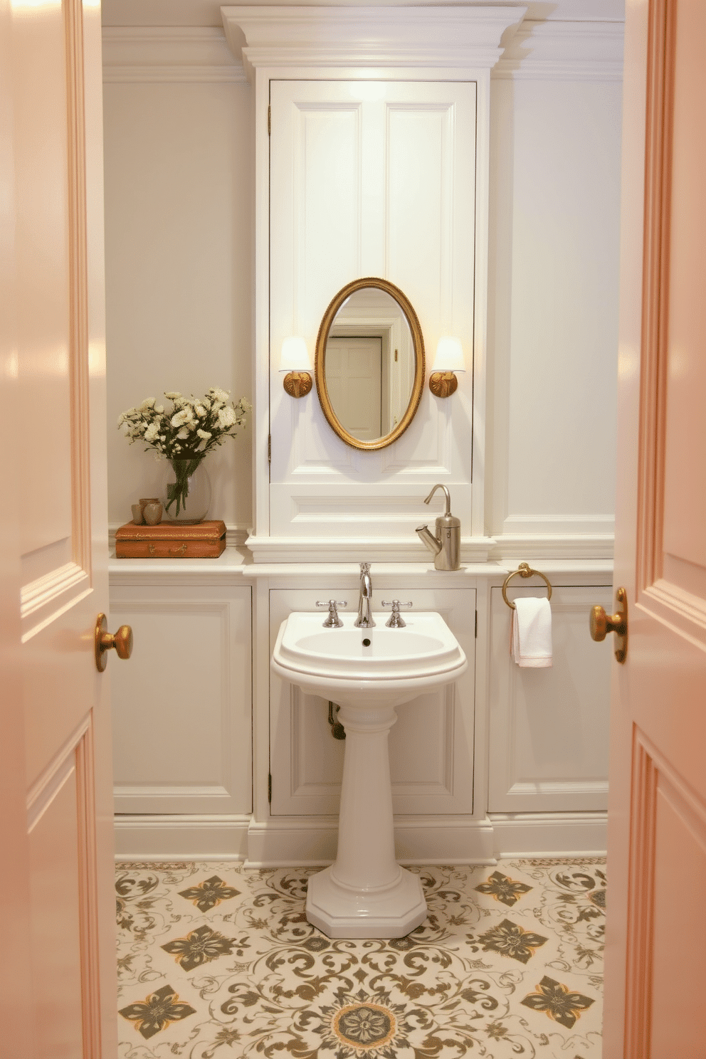 Crisp white cabinetry creates a fresh and inviting atmosphere in the European powder room. The space features elegant fixtures, including a sleek pedestal sink and a stylish wall-mounted faucet, complemented by intricate tile work on the floor. Soft lighting highlights the delicate details of the cabinetry, while a vintage mirror adds character above the sink. Accents of gold or brass in the hardware and accessories enhance the room's sophisticated charm.