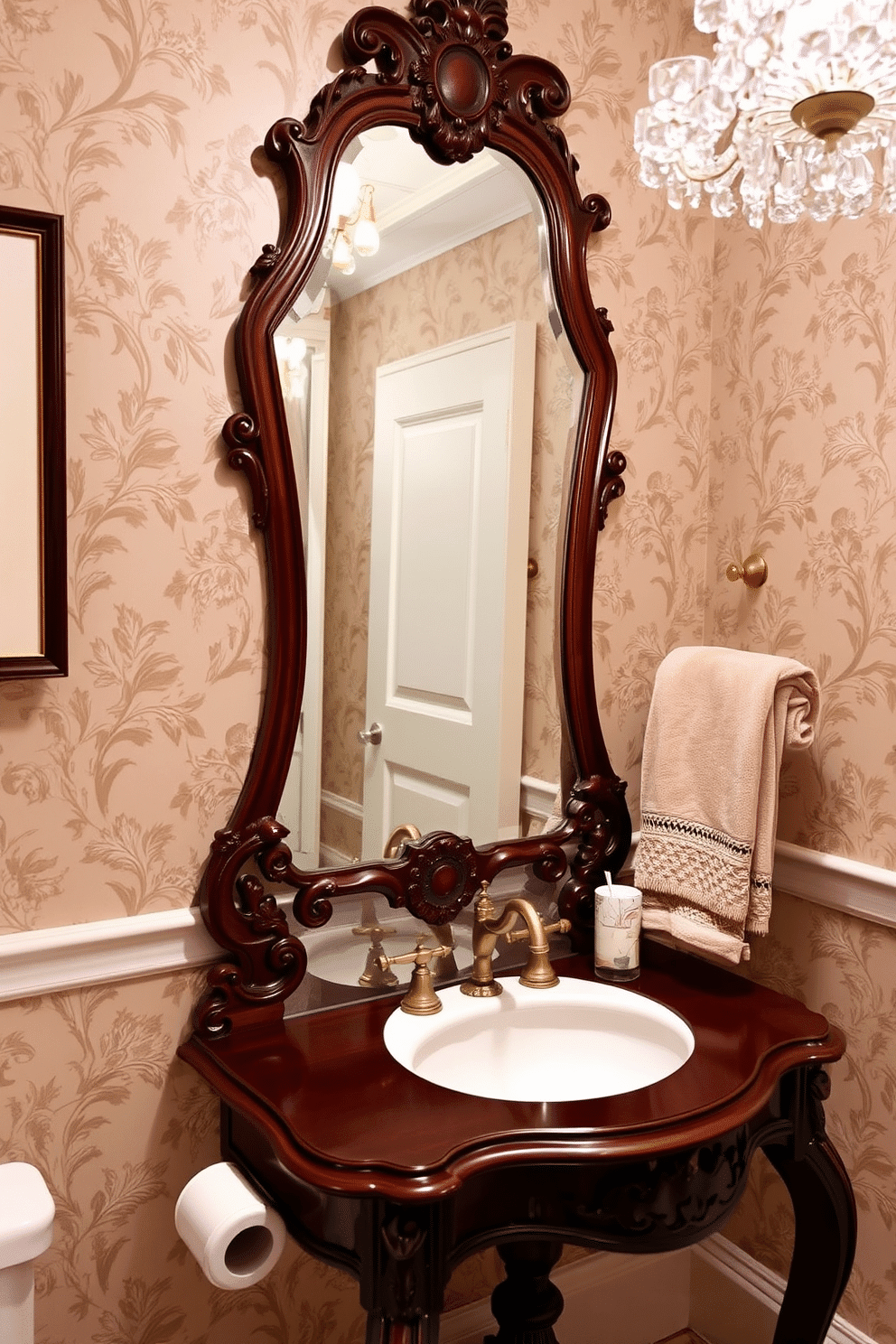 Antique mirror above a console table. The console table is elegantly crafted from dark wood, featuring intricate carvings and a polished surface that reflects the soft light from a nearby chandelier. The powder room is adorned with vintage wallpaper in muted tones, creating a cozy yet sophisticated atmosphere. A small, ornate sink with gold fixtures complements the antique mirror, while plush towels are neatly arranged on a stylish rack.