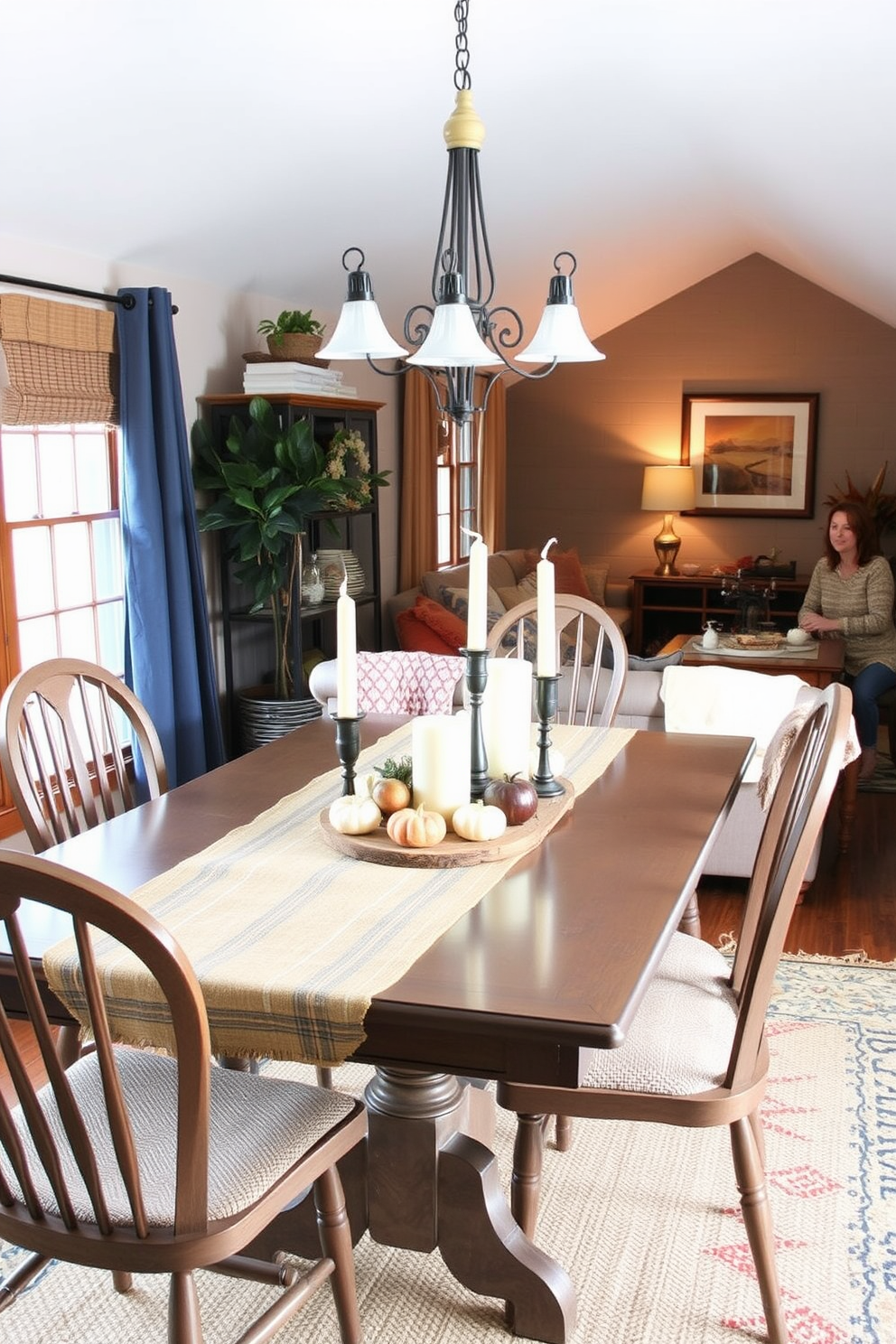 A cozy dining room featuring burlap table runners that add rustic charm to the setting. The table is adorned with seasonal decorations, including pumpkins and candles, creating a warm and inviting atmosphere. A charming attic space transformed into a fall retreat with cozy seating and warm colors. Soft blankets and decorative pillows enhance the inviting feel, while autumn-themed artwork adorns the walls.