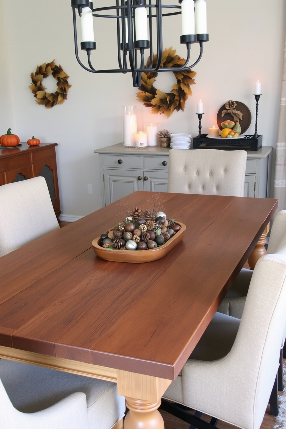 A cozy fall dining room featuring a rustic wooden table adorned with a centerpiece of acorns and pinecones. Surrounding the table are upholstered chairs in warm earth tones, with a backdrop of softly lit candles and autumn-themed decorations.