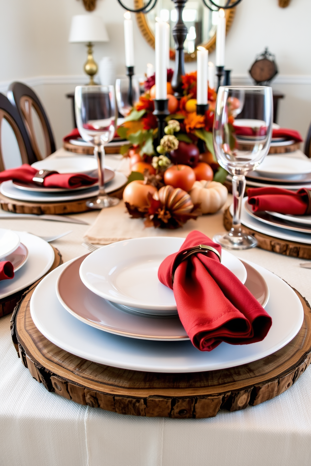 A beautifully set dining table featuring layered plates with contrasting textures. The base layer consists of rustic wooden chargers topped with elegant white porcelain plates, creating a stunning visual contrast. The table is adorned with autumn-inspired decor, including deep orange and burgundy napkins elegantly folded beside each plate. A centerpiece of seasonal fruits and candles adds warmth and charm to the fall dining room setting.