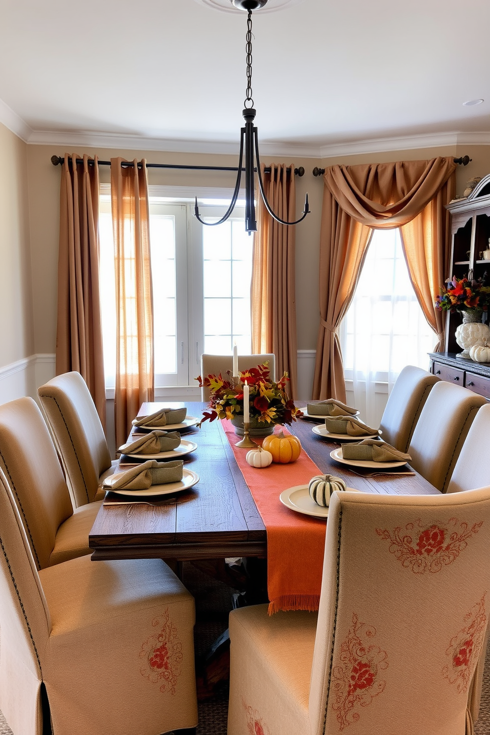 A cozy dining room adorned with earthy tones in table linens and napkins. The table is set with a rustic wooden table and surrounded by upholstered chairs in warm, neutral shades. Soft, natural light filters through sheer curtains, creating an inviting atmosphere. Centered on the table is a seasonal centerpiece featuring autumn leaves, small pumpkins, and candles for a touch of warmth.