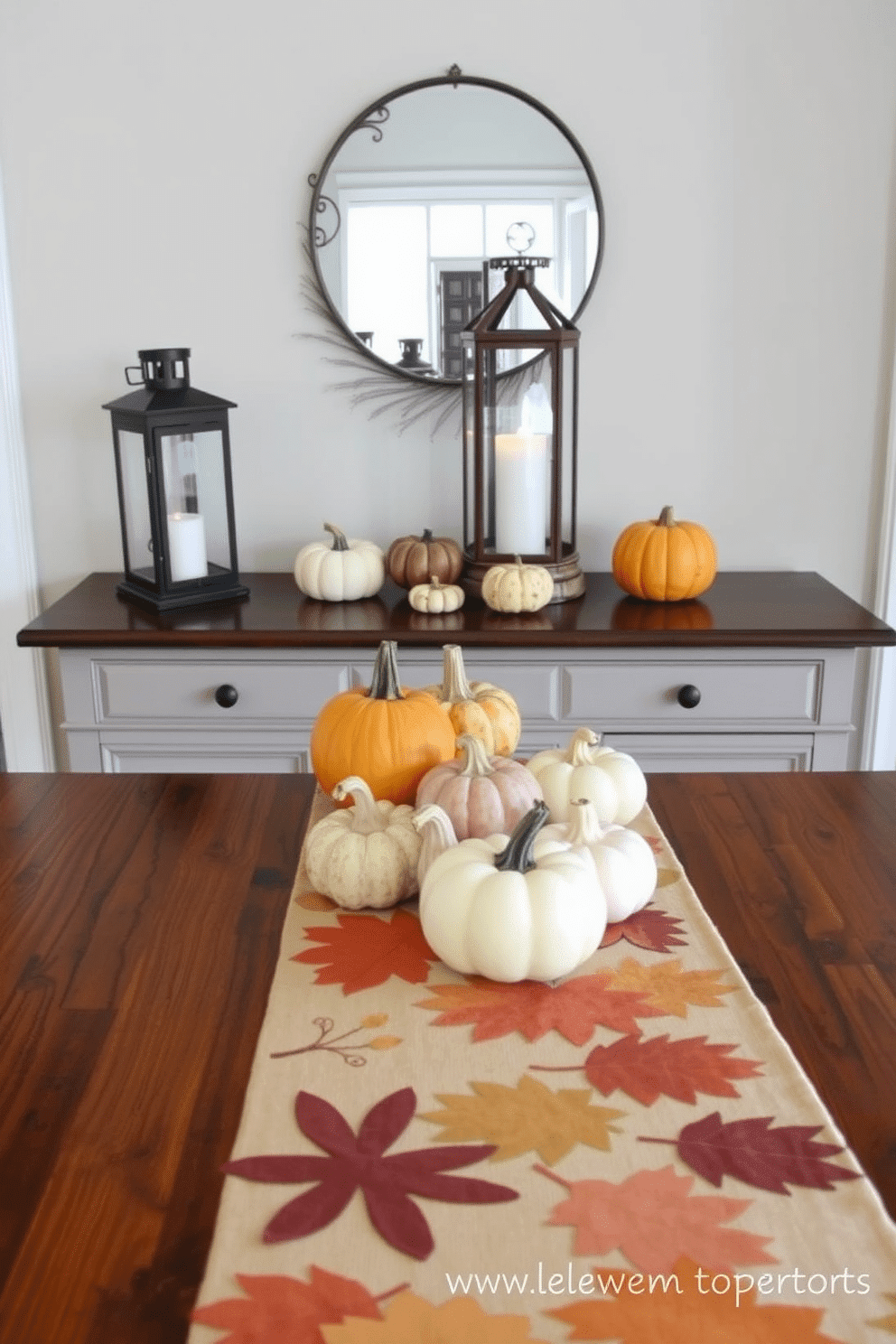 A warm and inviting entryway features a console table adorned with a harvest-themed table runner that showcases rich autumn colors. On the table, a selection of decorative pumpkins and gourds in varying sizes adds a seasonal touch, while a rustic lantern with a flickering candle provides soft illumination.