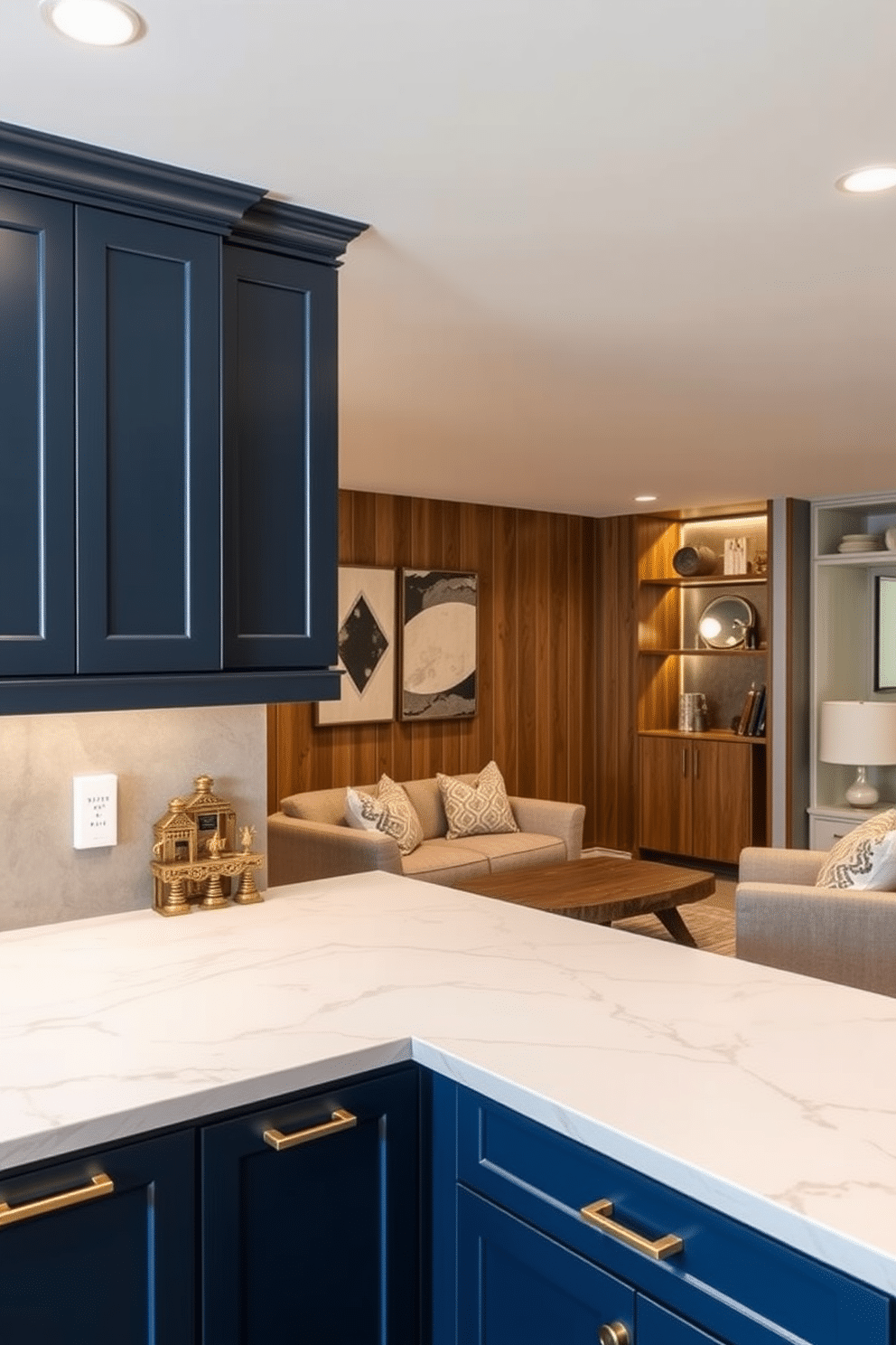 A trendy kitchenette for entertaining guests features sleek, modern cabinetry in a deep navy blue, complemented by brass hardware. The countertop is a stunning white quartz with subtle gray veining, and a stylish island with bar stools creates an inviting space for socializing. The finished basement design showcases an open layout with cozy seating areas, including a plush sectional sofa and a rustic coffee table. Warm ambient lighting highlights the wood-paneled walls, while a wet bar with elegant shelving offers a perfect spot for refreshments.