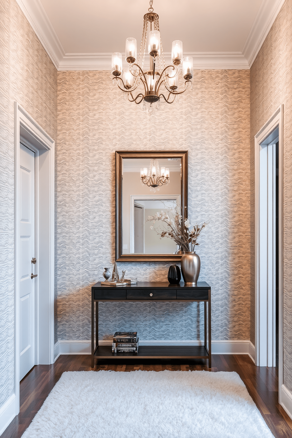 A stunning foyer featuring textured wallpaper that adds depth and visual interest to the space. The entryway is illuminated by a stylish chandelier, and a console table adorned with decorative items creates an inviting atmosphere. The walls are covered in a subtle geometric patterned wallpaper that complements the elegant color palette. A large mirror above the console table reflects light and enhances the sense of space, while a plush area rug anchors the design.