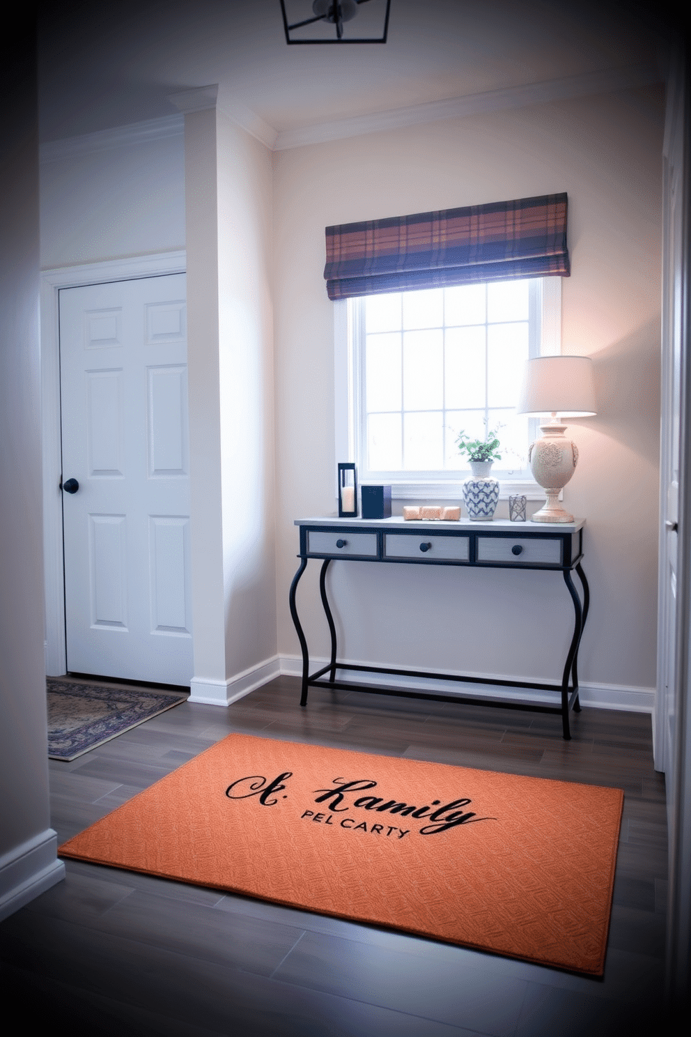 A charming foyer entryway features a personalized welcome mat adorned with a family name in elegant script. The walls are painted in a soft pastel hue, complemented by a stylish console table topped with decorative accents and a small potted plant.