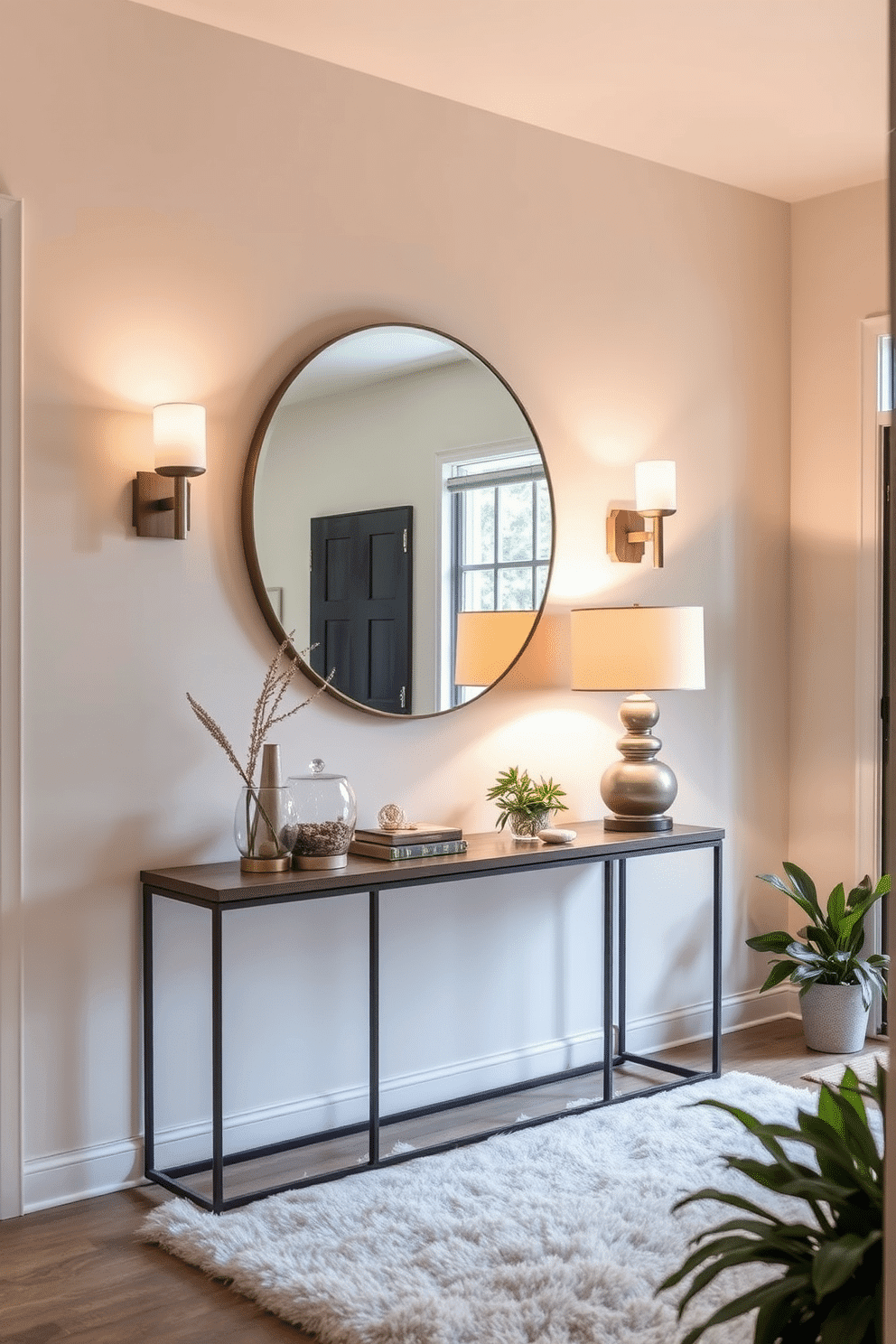 A welcoming foyer entryway features a statement console table with a sleek design, topped with decorative accents and a large round mirror. Layered lighting is achieved through elegant wall sconces flanking the mirror and a stylish table lamp that adds warmth to the space. The walls are painted in a soft neutral tone, enhancing the natural light that floods in through a nearby window. A plush area rug anchors the space, while a few potted plants add a touch of greenery, creating an inviting atmosphere.