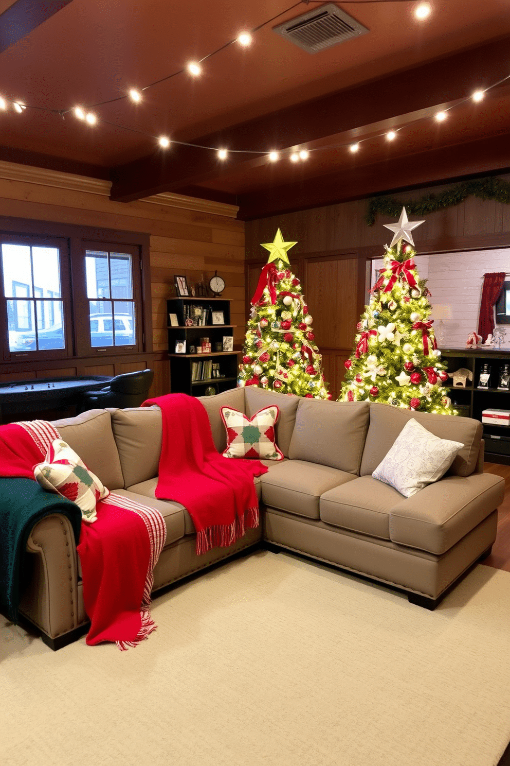 A cozy game room adorned for the holidays features a plush sectional sofa draped with throw blankets in vibrant festive colors, creating an inviting atmosphere. String lights twinkle above, while a beautifully decorated Christmas tree stands in the corner, surrounded by cheerful holiday decor.