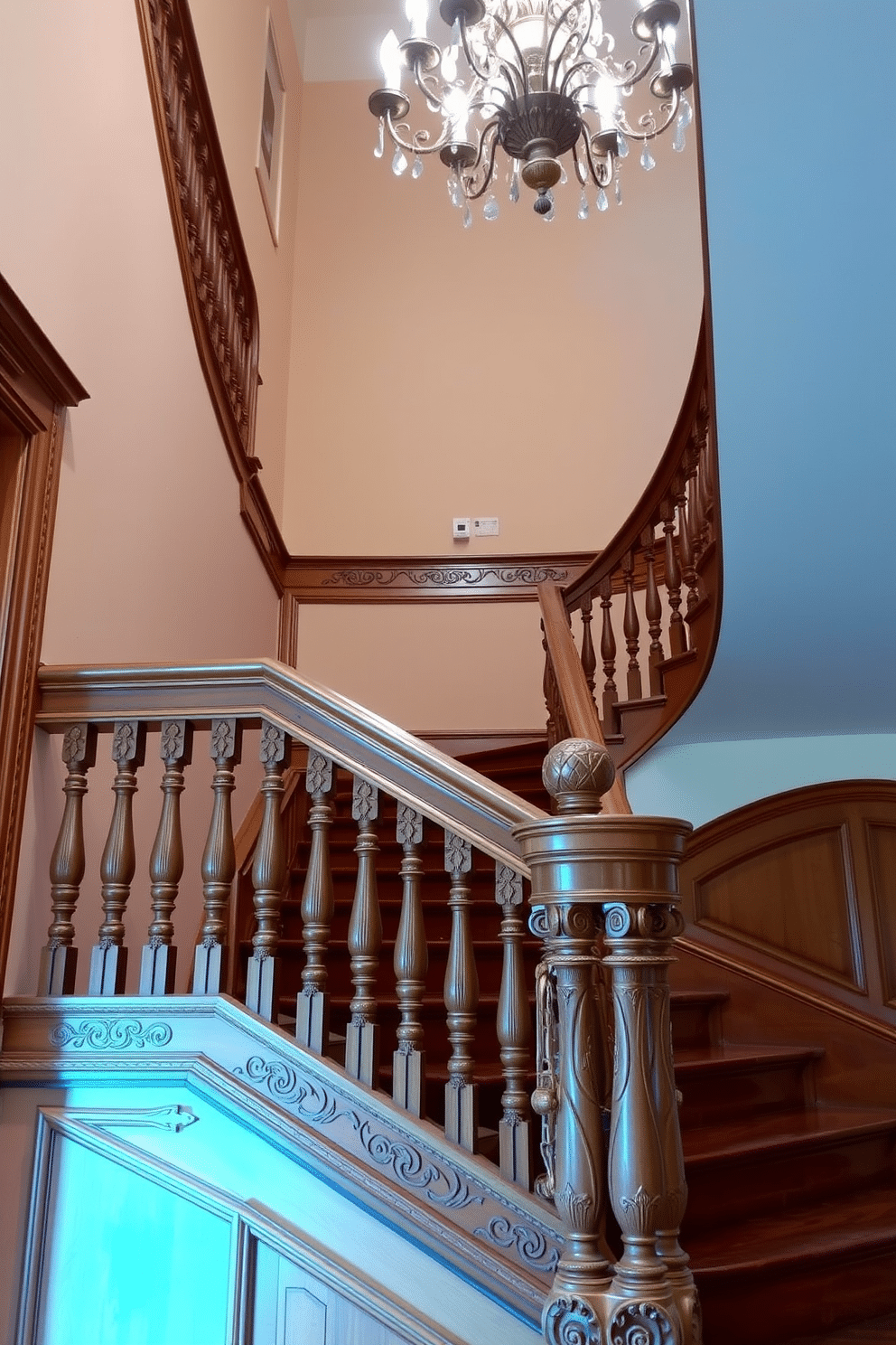 A classic staircase with intricate carvings showcases elegant craftsmanship and timeless design. The wooden steps are complemented by a detailed banister, featuring ornate spindles and a polished handrail that adds a touch of sophistication. The walls alongside the staircase are adorned with soft, neutral tones, enhancing the grandeur of the space. A stunning chandelier hangs above, casting a warm glow that highlights the intricate details of the staircase.