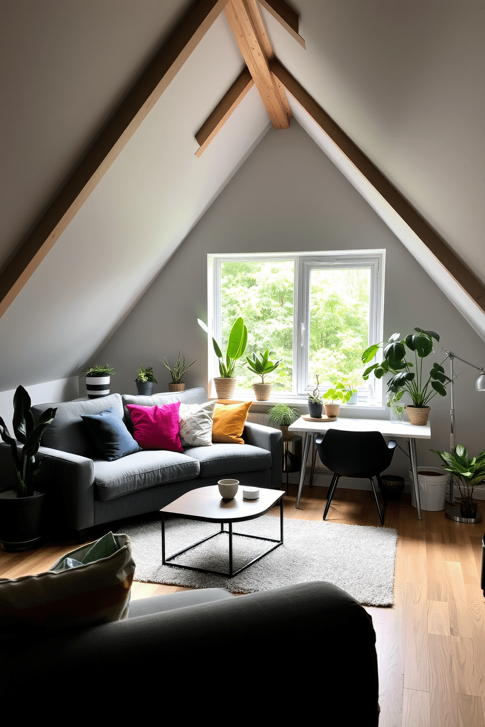 A cozy gray attic room filled with natural light, featuring sloped ceilings and exposed wooden beams. A plush gray sofa is positioned against the wall, adorned with colorful throw pillows, while a stylish coffee table sits in front. In one corner, a collection of potted plants adds a fresh touch, creating a vibrant contrast against the neutral tones. A small desk with a sleek chair is placed by the window, providing a perfect workspace with a view of the greenery outside.