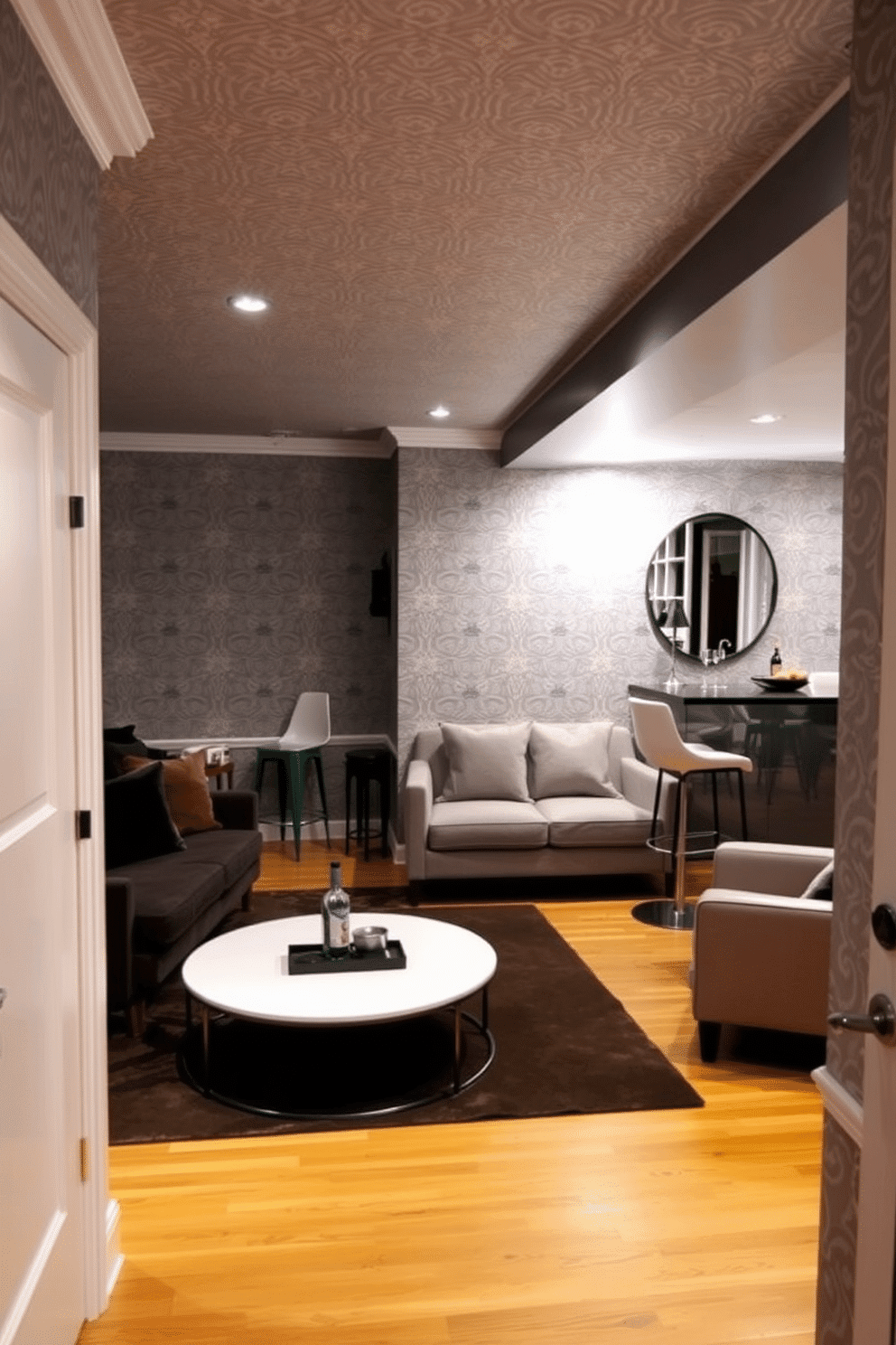 A stylish gray basement featuring patterned wallpaper that adds visual interest to the space. The room includes a cozy seating area with plush sofas and a sleek coffee table, creating an inviting atmosphere for relaxation. In one corner, a home bar with modern stools complements the decor, while ambient lighting enhances the overall mood. The flooring is a warm wood tone, contrasting beautifully with the gray tones of the wallpaper and furnishings.