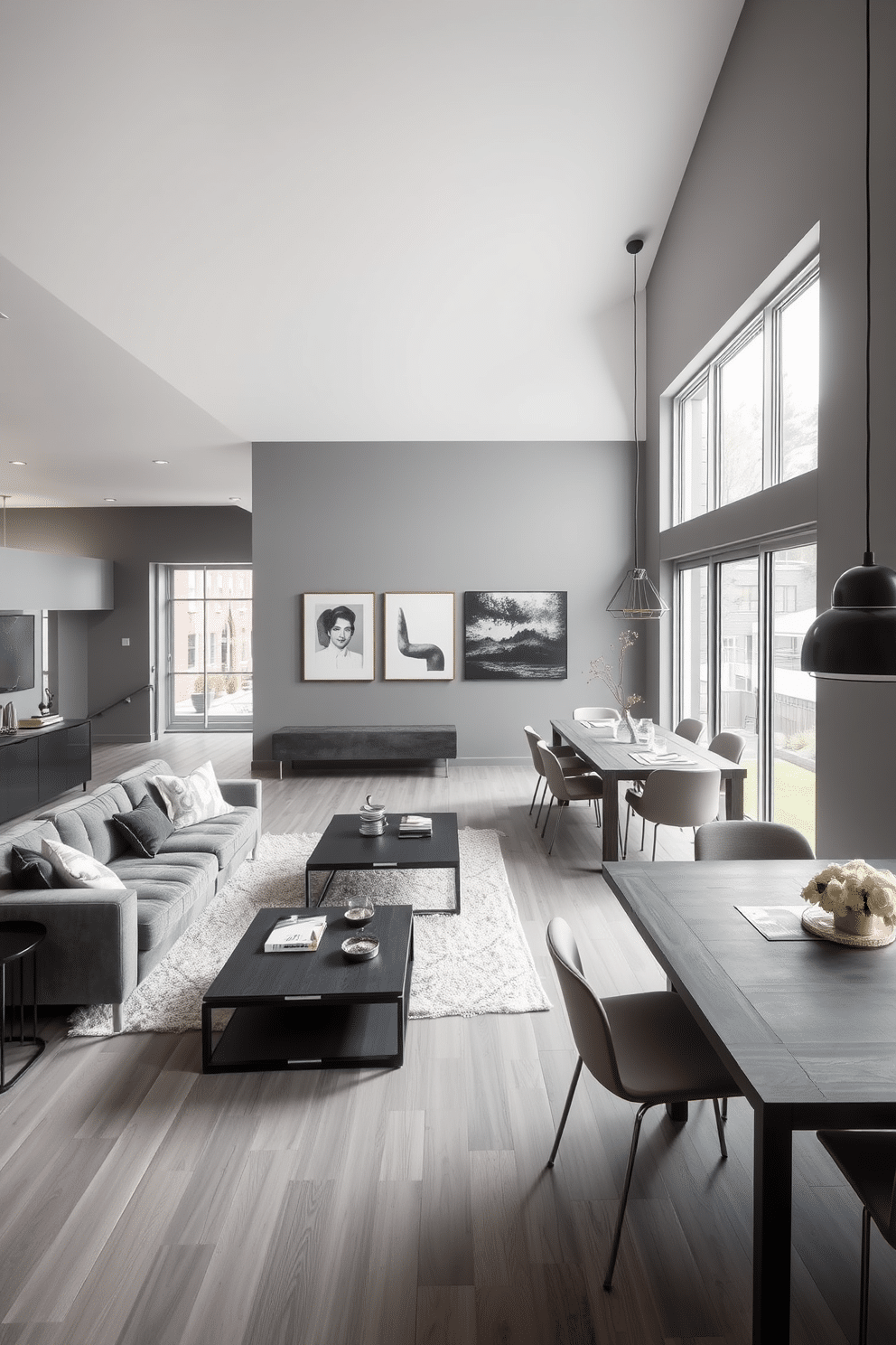 An open layout featuring defined gray zones creates a modern and inviting atmosphere. The space includes a plush gray sectional sofa centered around a sleek coffee table, with a soft area rug anchoring the seating area. Adjacent to the living area, a contemporary dining space showcases a gray wood table surrounded by stylish chairs. Large windows allow natural light to flood the room, highlighting the subtle variations in the gray tones of the walls and furnishings.