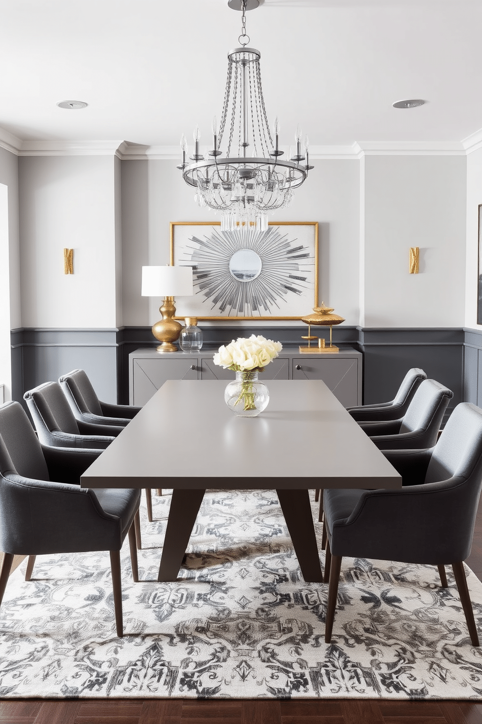 A modern dining room featuring a sleek gray dining table surrounded by plush gray upholstered chairs. The walls are painted in a soft gray hue, while gold accents are introduced through a stunning chandelier and decorative wall art. In the center of the room, a geometric-patterned area rug adds texture, complementing the overall color scheme. A stylish sideboard in a matching gray finish showcases elegant gold decor pieces, creating a harmonious blend of sophistication and warmth.