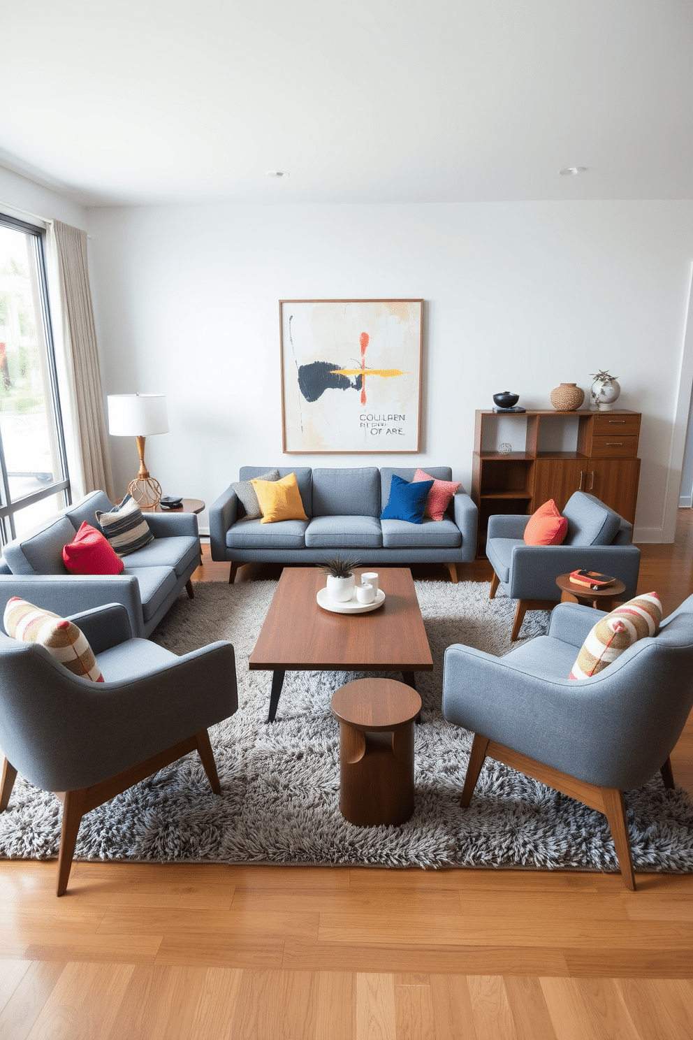 A stylish family room featuring mid-century furniture with gray upholstery. The room is anchored by a sleek, low-profile sofa adorned with colorful throw pillows, complemented by a pair of sculptural armchairs that echo the mid-century aesthetic. A wooden coffee table with clean lines sits at the center, surrounded by a plush area rug that adds warmth to the space. Large windows allow natural light to flood in, highlighting the room's minimalist decor and a statement piece of abstract art on the wall.