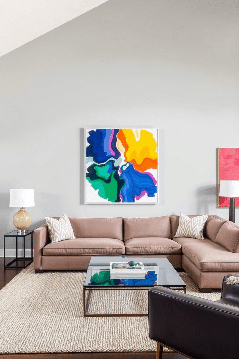 Bright artwork against a gray backdrop creates a striking focal point in the family room. The walls are painted a soft gray, providing a neutral canvas that enhances the vibrancy of the colorful art pieces. A plush sectional sofa in a muted tone complements the artwork while offering ample seating. A sleek coffee table with a glass top sits at the center, surrounded by textured area rugs that add warmth to the space.