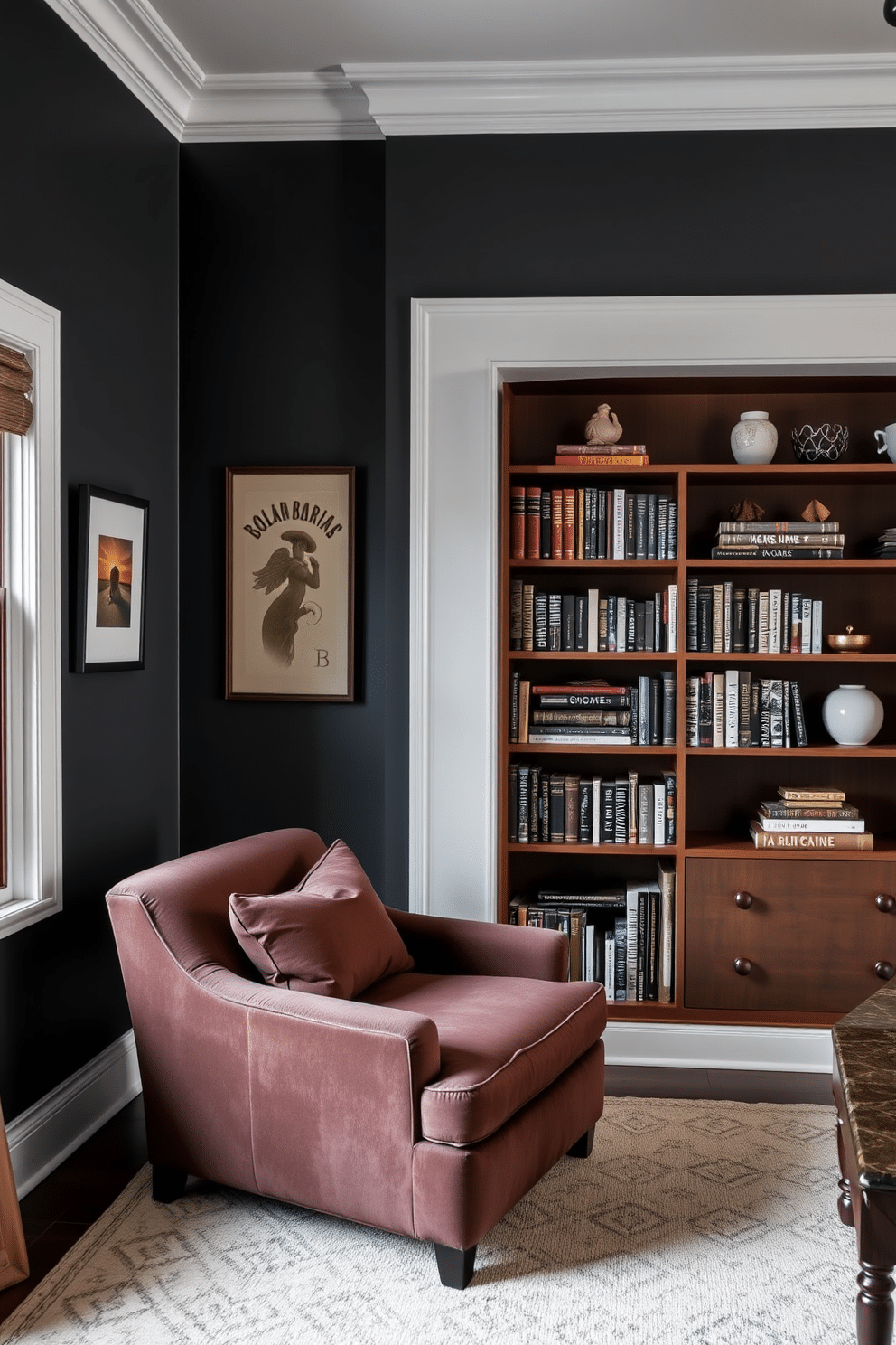 A cozy home library featuring dark gray walls that create a dramatic backdrop, complemented by crisp white trim accents. The room is furnished with a plush, oversized armchair in a rich fabric, paired with a sleek wooden bookshelf filled with an array of books and decorative objects.