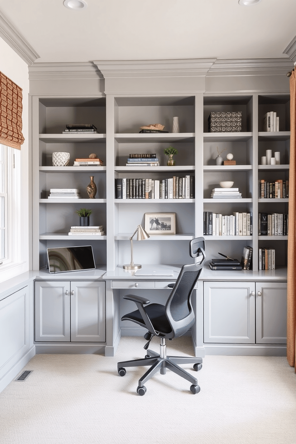 A stylish gray home office features open shelving in a soft gray finish, elegantly displaying books and decorative items. A sleek desk, complemented by a comfortable ergonomic chair, is positioned to maximize natural light from a nearby window.