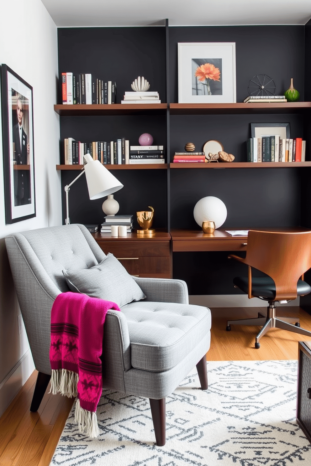 A cozy gray armchair is positioned in the corner of a stylish home office, adorned with a vibrant, colorful throw draped over one side. The office features a sleek wooden desk, complemented by a modern desk lamp and a backdrop of floating shelves filled with books and decorative items.