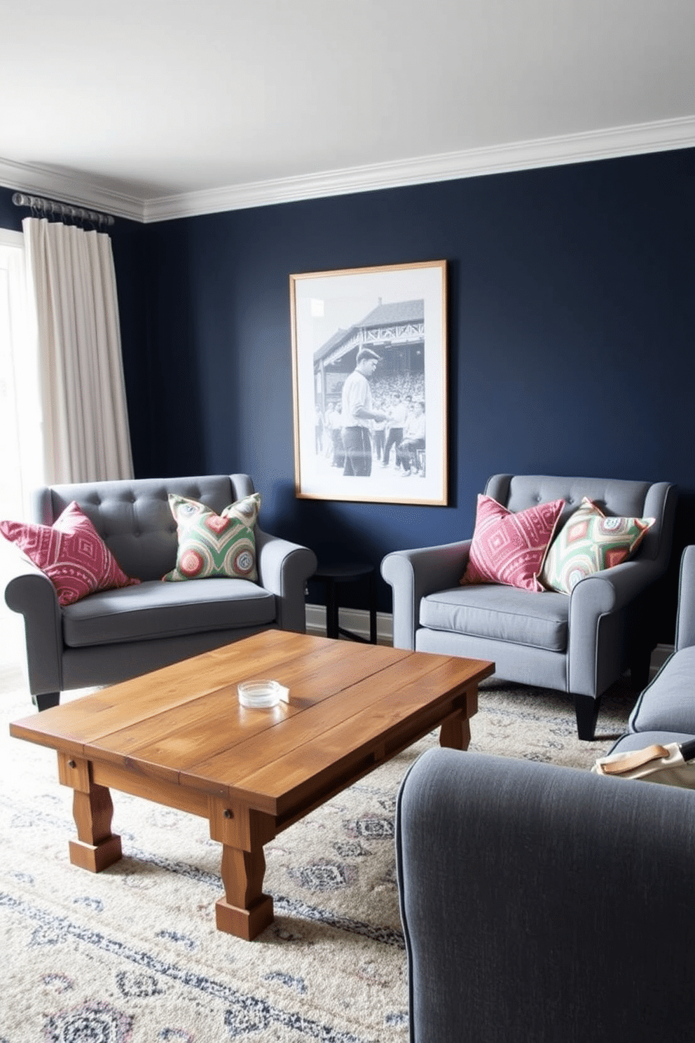 A stylish man cave featuring gray accent chairs adorned with vibrant, colorful cushions that add a pop of personality to the space. The walls are painted a deep navy blue, creating a cozy atmosphere, while a rustic wooden coffee table sits in front of the chairs, perfect for entertaining guests.