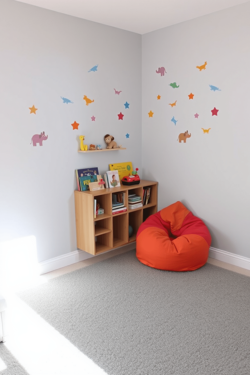 A cozy playroom featuring a soft gray play mat that provides a safe and comfortable area for children to play. The walls are painted in a light gray hue, complemented by colorful wall decals of animals and shapes to stimulate creativity. In one corner, there is a low wooden shelf filled with an assortment of toys and books, easily accessible for little hands. A plush bean bag chair in a vibrant color adds a playful touch, inviting kids to sit and read or relax.