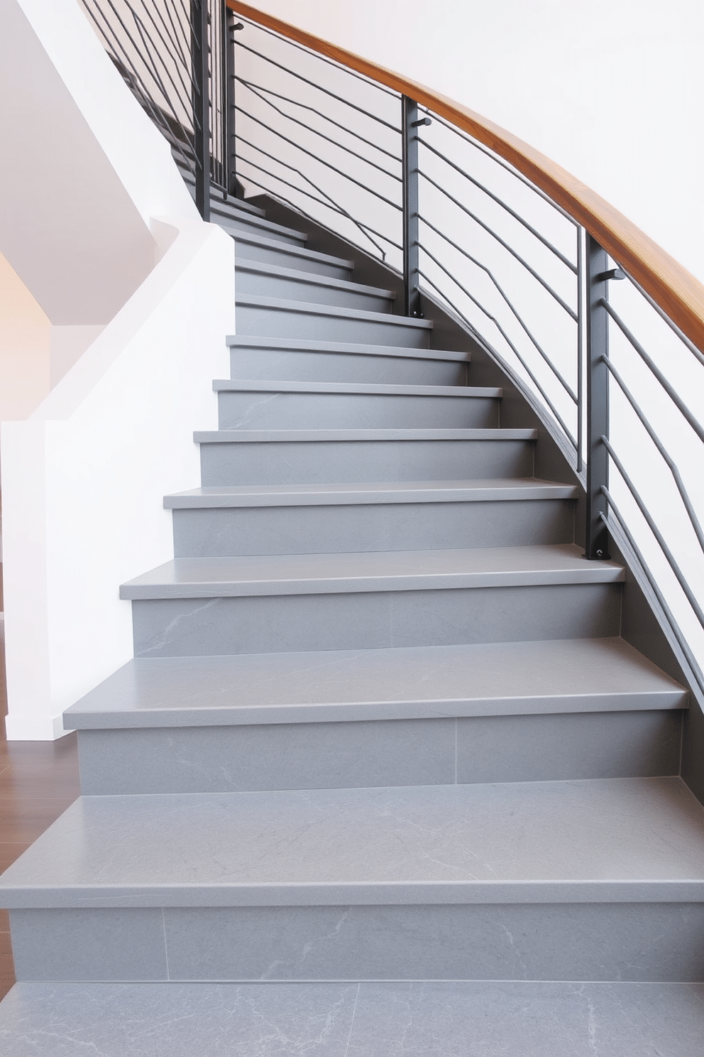 A modern gray staircase features a sleek metal railing with warm wood accents, seamlessly blending contemporary design with natural elements. The steps are finished in a polished gray stone, creating a sophisticated contrast against the rich wood detailing of the railing.