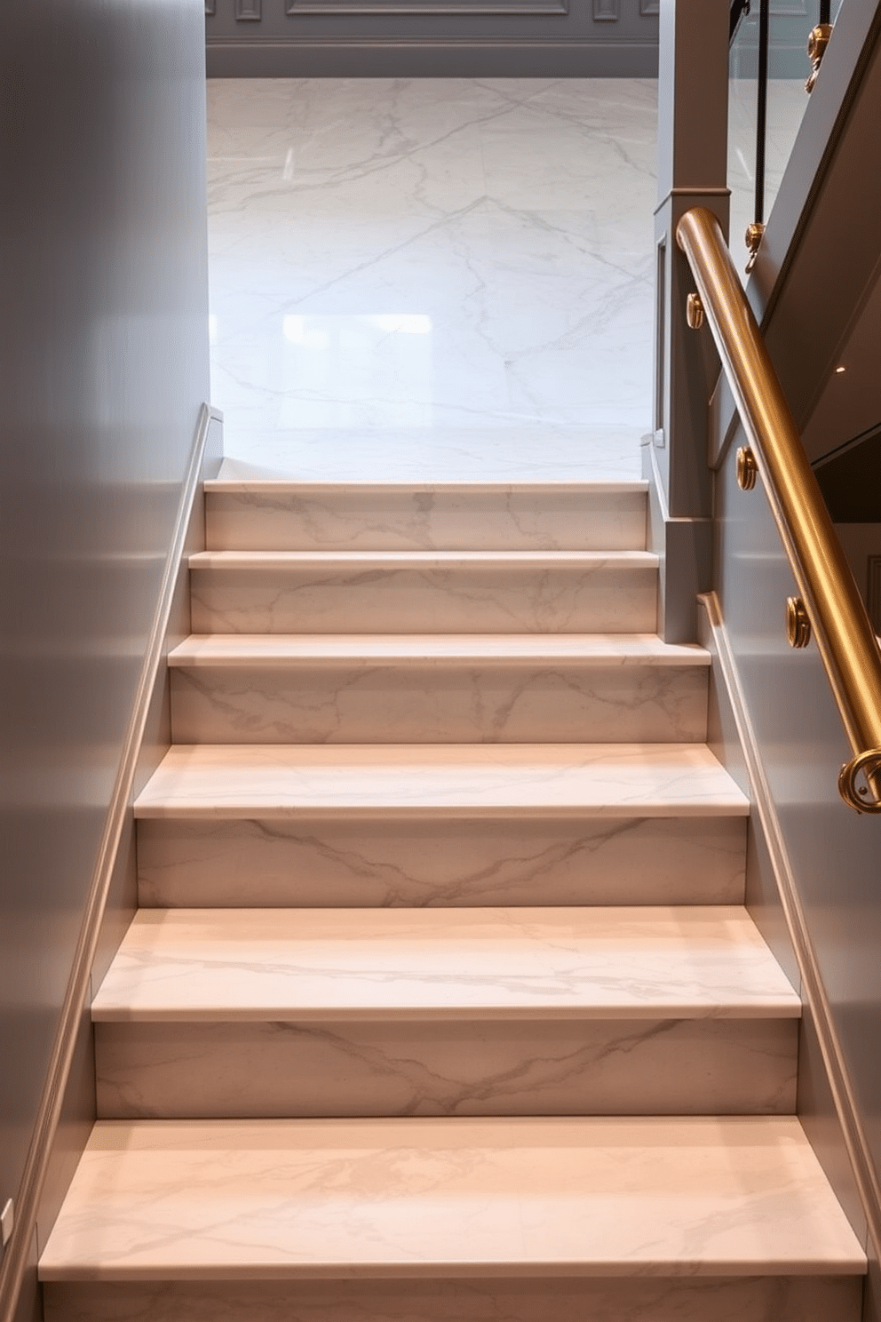 Classic gray marble steps with brass accents create an elegant and timeless entryway. The polished surface of the marble contrasts beautifully with the warm glow of the brass, enhancing the overall sophistication of the staircase. The staircase features a sleek handrail with intricate brass detailing, adding a touch of luxury. Soft, ambient lighting highlights the marble's veining, creating a stunning visual effect as you ascend or descend the steps.