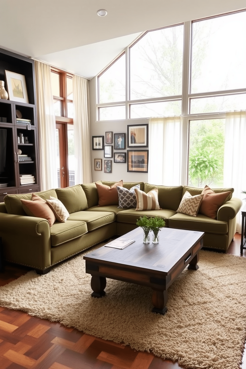 A cozy family room featuring an olive green sectional sofa adorned with a variety of patterned throw pillows in warm tones. The space is enhanced by a rustic wooden coffee table at the center, surrounded by a soft area rug that adds texture and warmth to the room. Large windows allow natural light to flood in, showcasing sheer curtains that gently frame the view outside. A gallery wall filled with family photos and artwork adds a personal touch, creating an inviting atmosphere for gatherings.