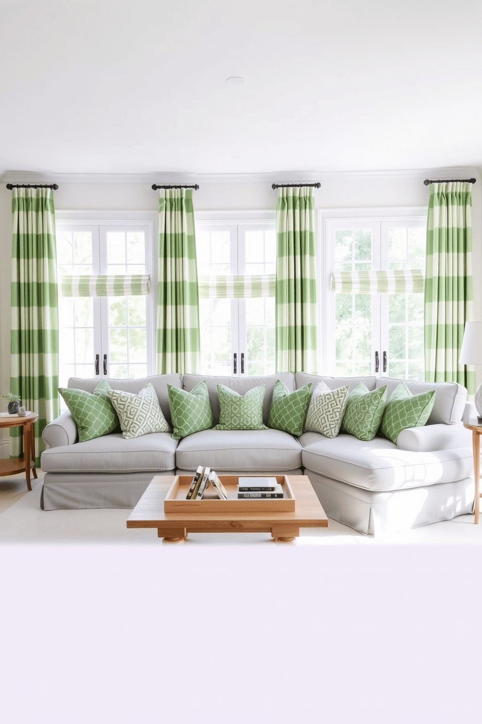 Crisp green and white striped curtains frame the large windows, allowing natural light to flood the family room. The walls are painted a soft white, creating a fresh and airy atmosphere that complements the vibrant curtains. A plush, light gray sectional sofa is positioned in the center, adorned with an array of green and white patterned throw pillows. A natural wood coffee table sits in front, topped with a decorative tray and a few carefully chosen books, enhancing the inviting feel of the space.