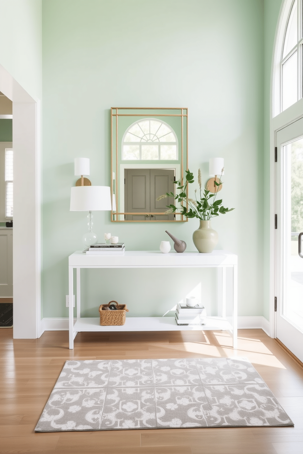 A refreshing mint green foyer welcomes guests with an airy and light atmosphere. The walls are painted in a soft mint shade, complemented by a sleek white console table adorned with a few carefully chosen decorative items. Natural light floods in through a large window, illuminating a stylish area rug that adds warmth to the space. A statement mirror with a minimalist frame hangs above the console, enhancing the sense of openness and inviting elegance.